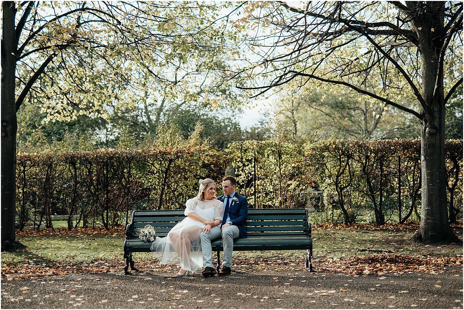 Wedding couple sitting bench 
