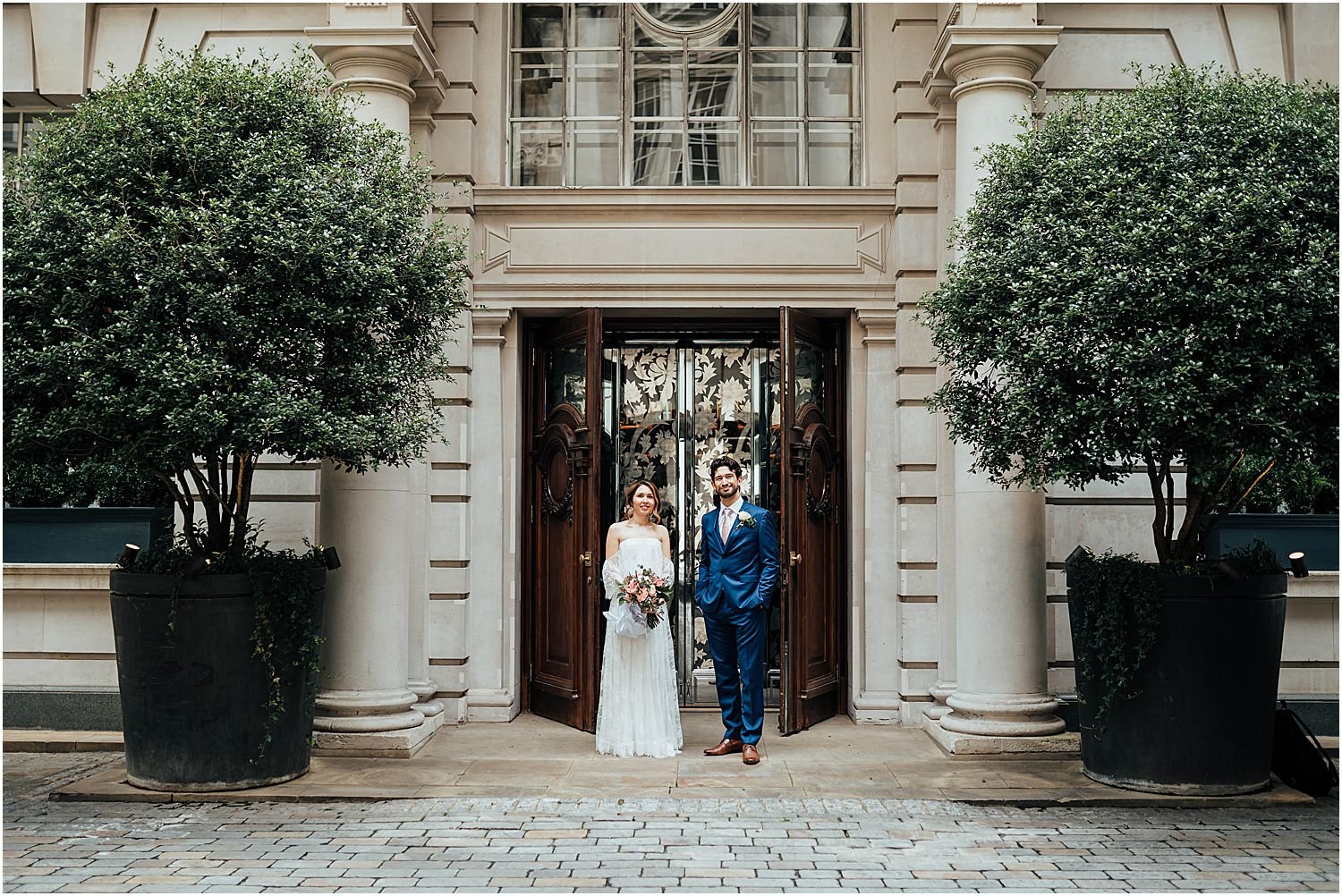 Wedding couple in courtyard at Rosewood Hotel
