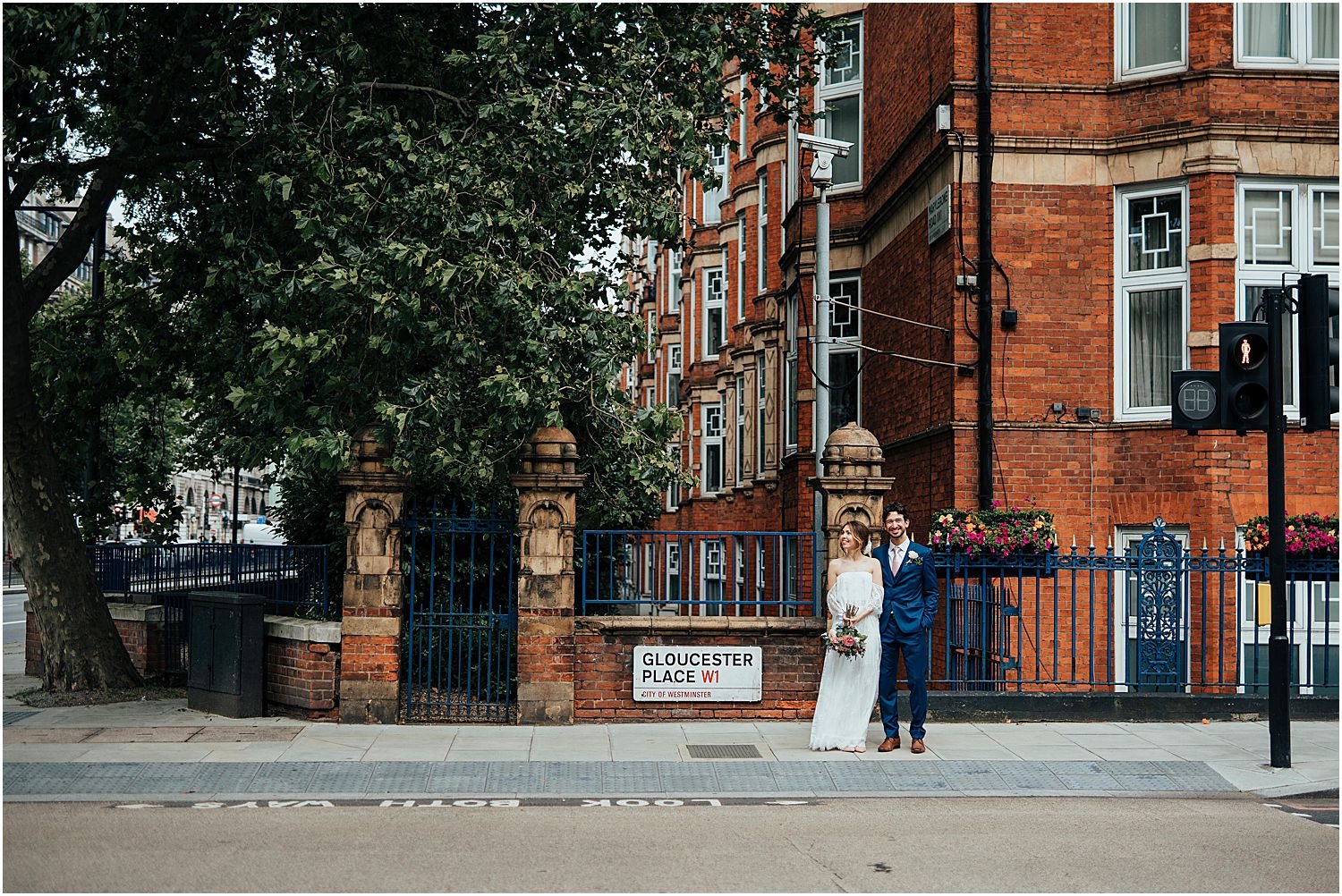 Bride and groom crossing street in London
