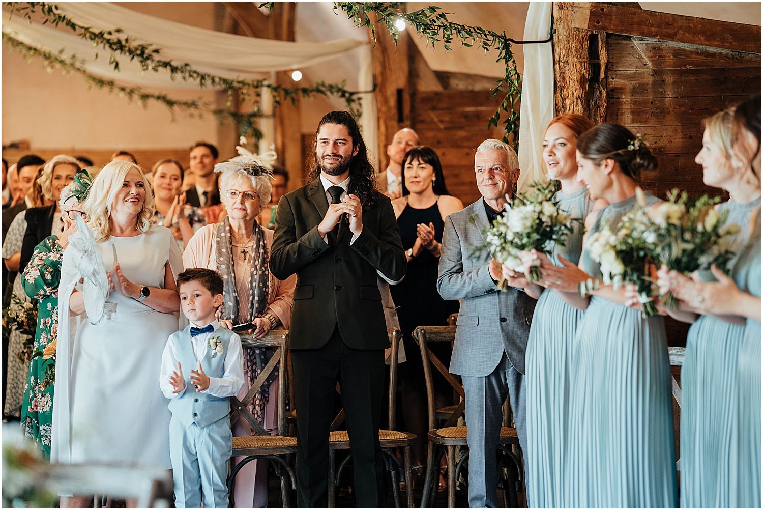 Guests clapping during wedding ceremony