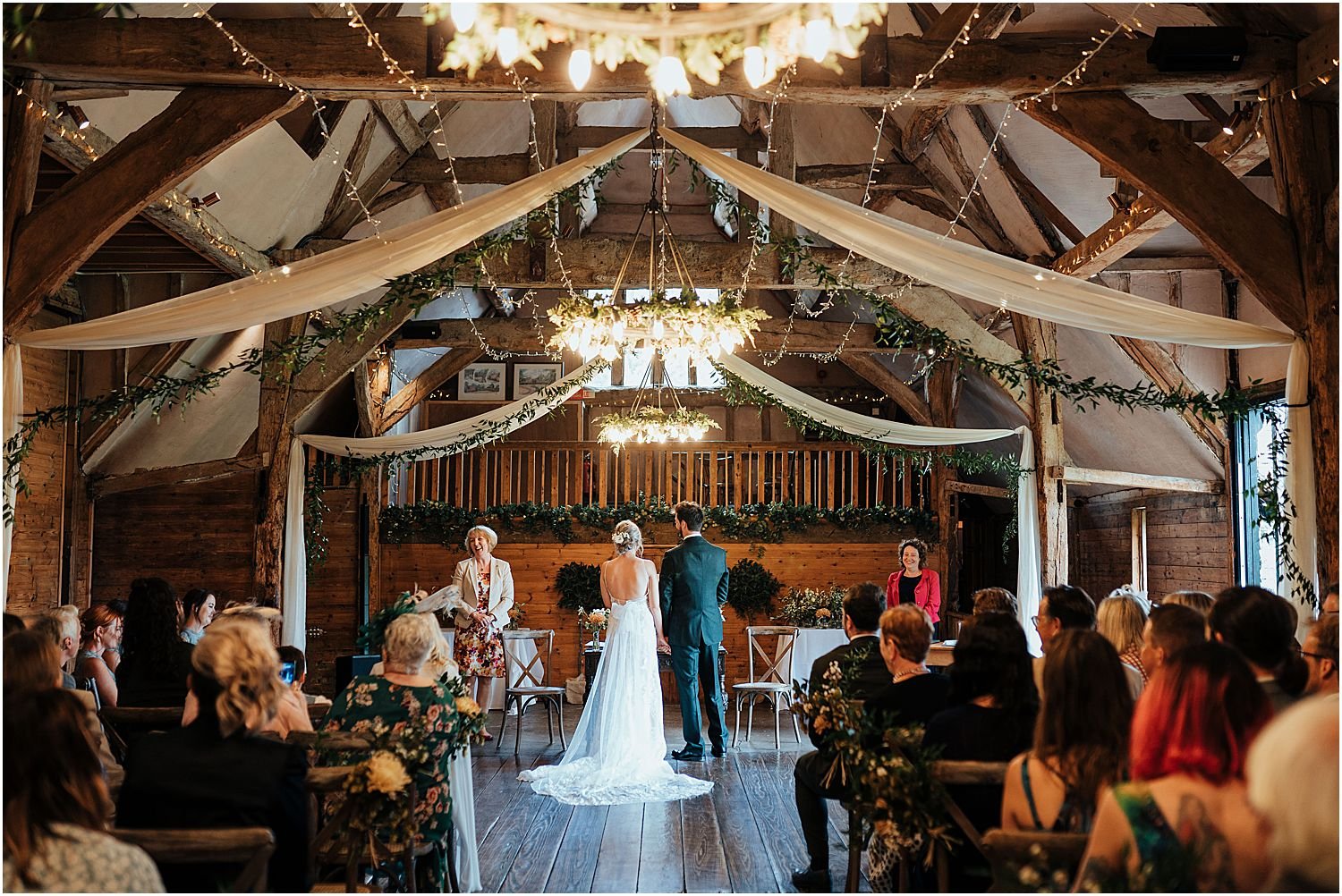 Bride and groom during wedding ceremony at Lains Barn