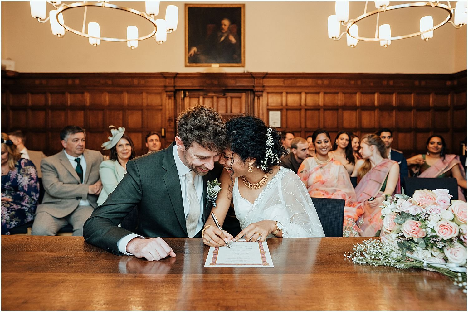 Bride and Groom signing marriage register at Oxford Town Hall