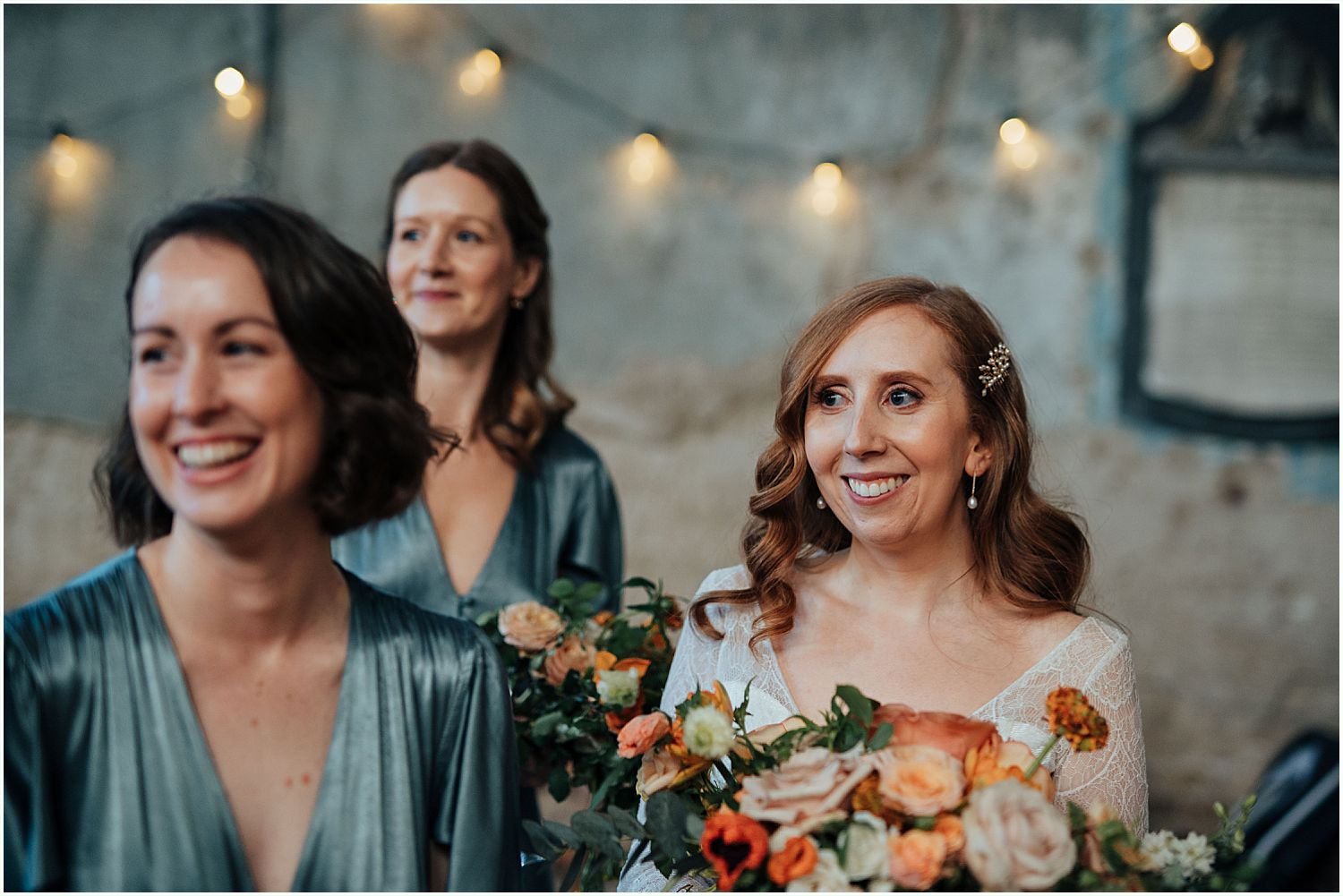 Photo of bride and bridesmaids laughing