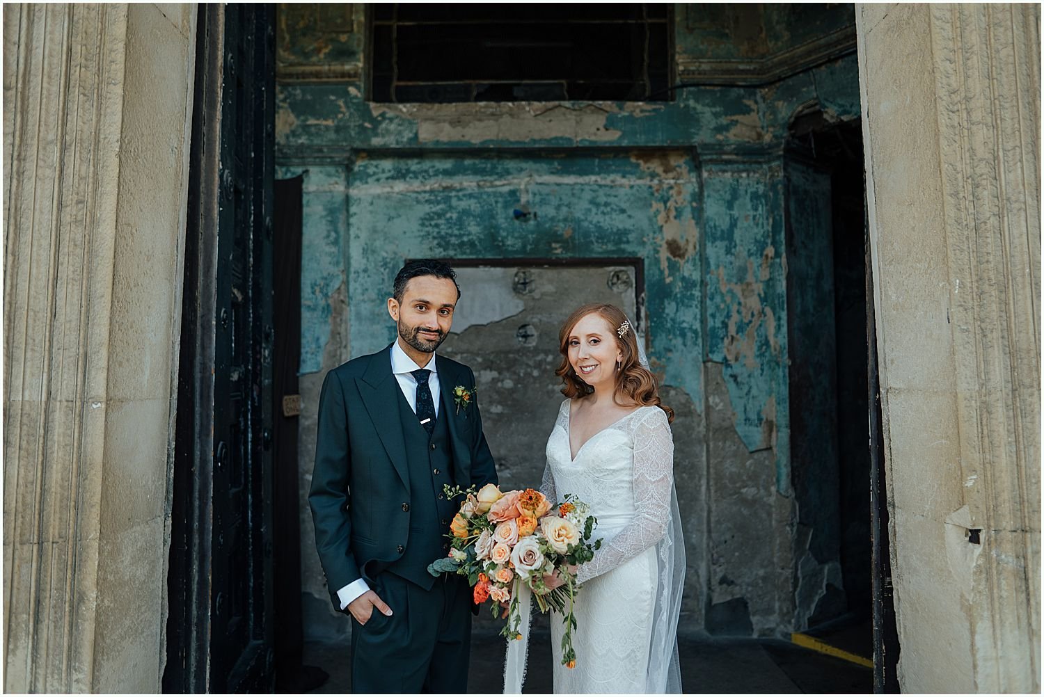 Bride and groom in front of doors