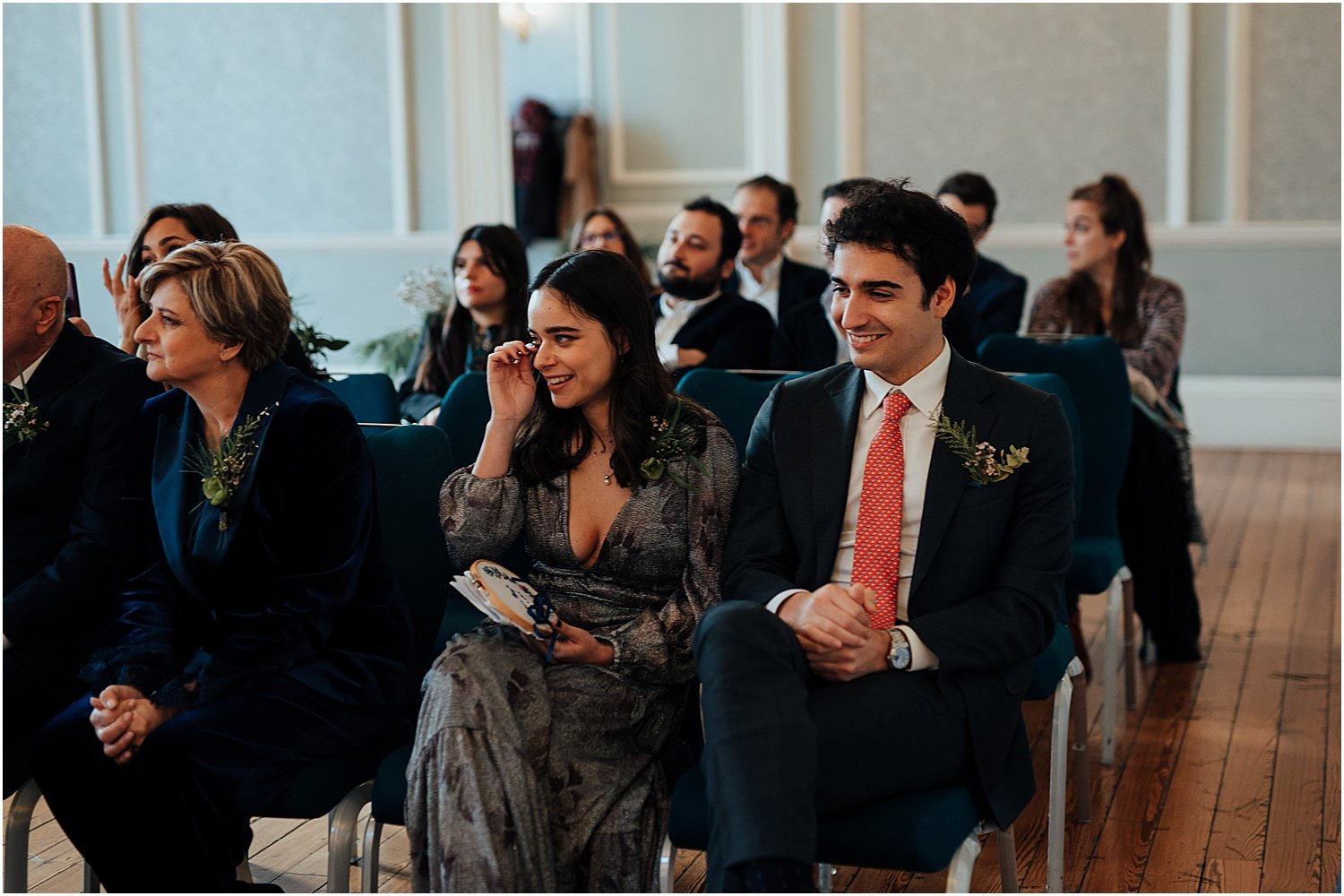 Candid wedding photo of guests during ceremony
