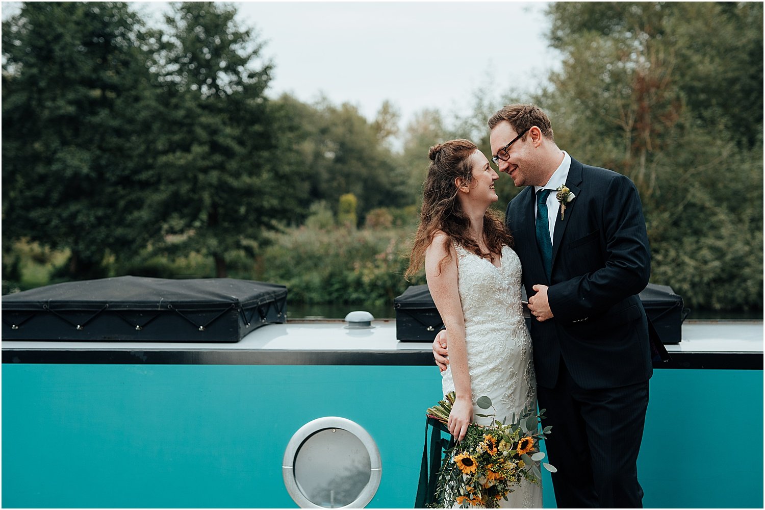 Wedding couple photo in front of boat