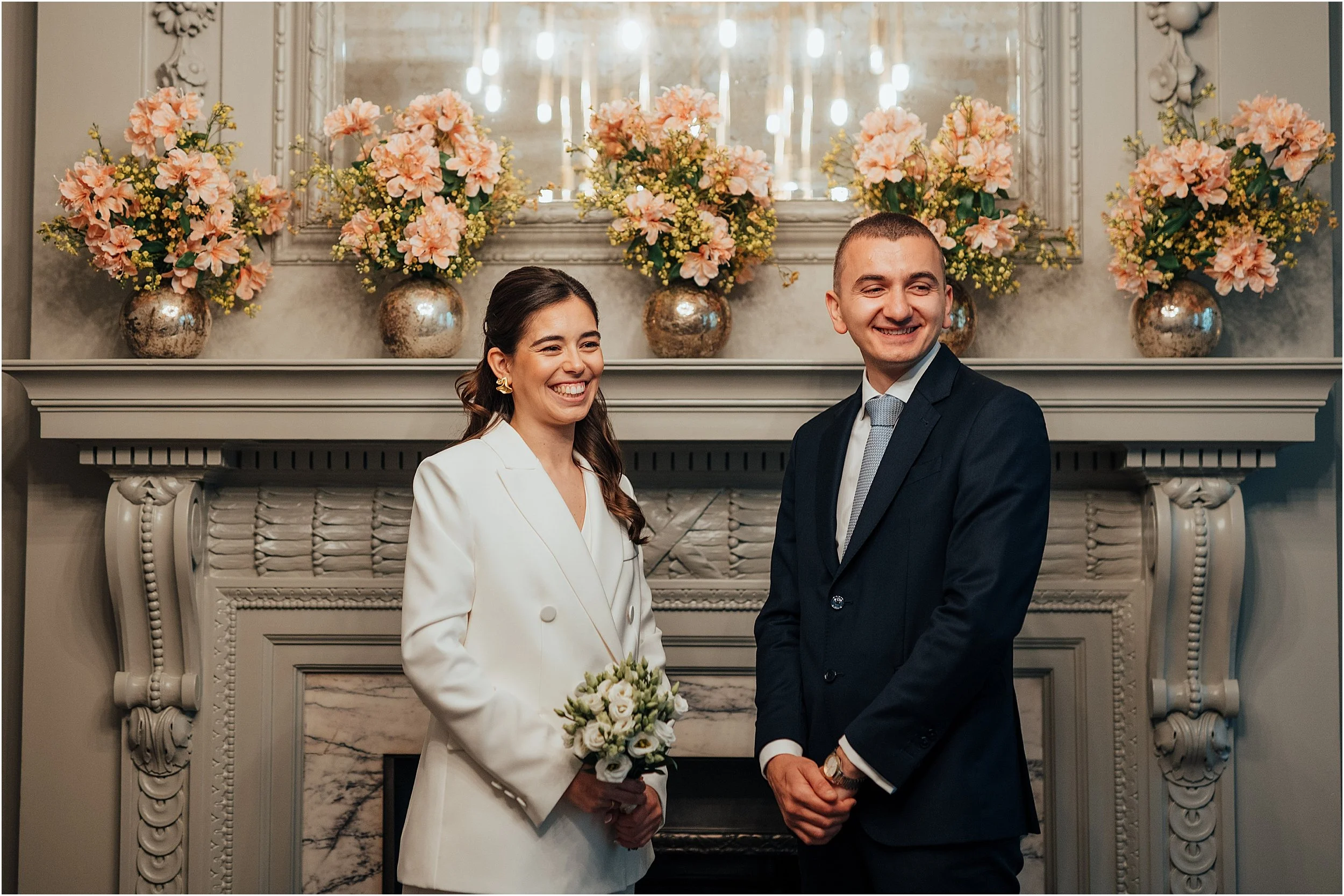 Bride and groom exchanging vows in Soho room