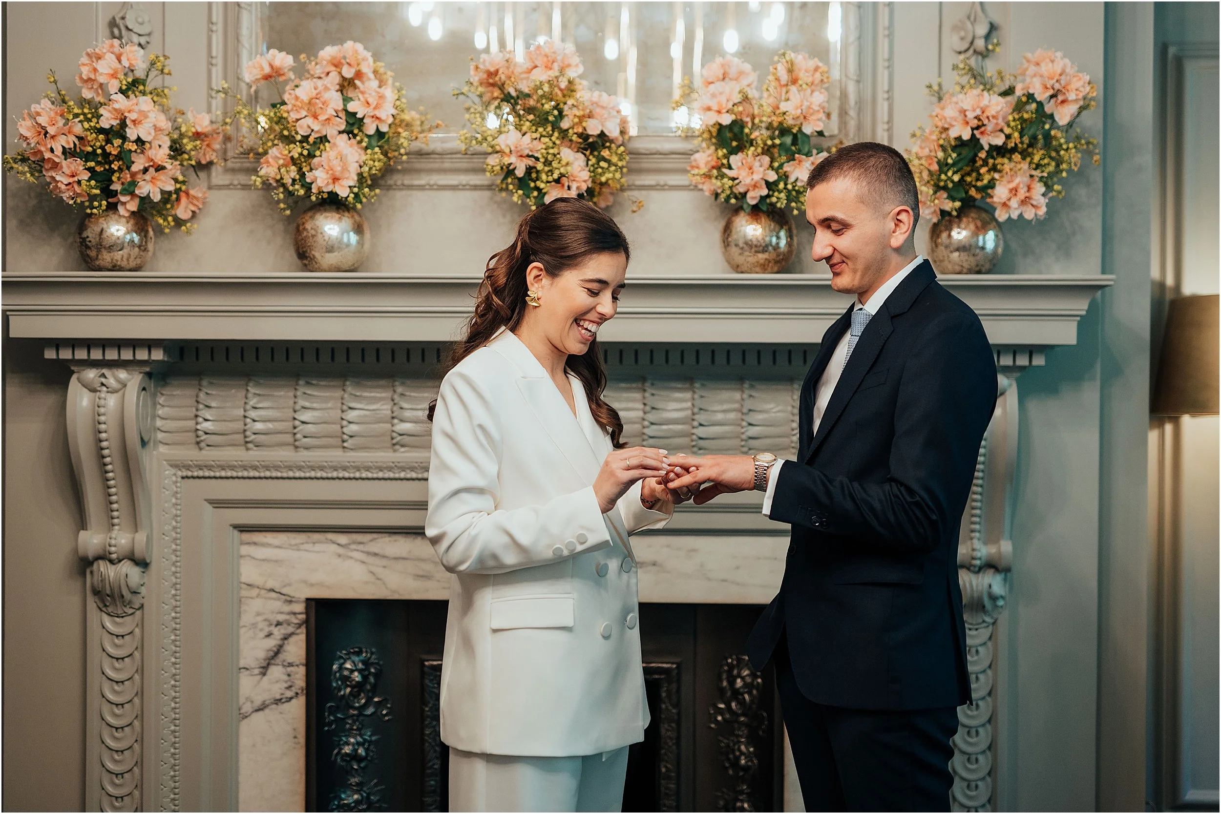 Bride and groom exchanging rings at the Old Marylebone Town Hall