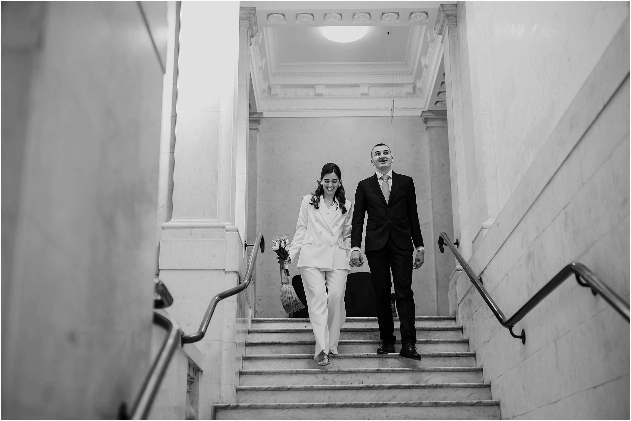 Couple walking down stairs at the Old Marylebone Town Hall