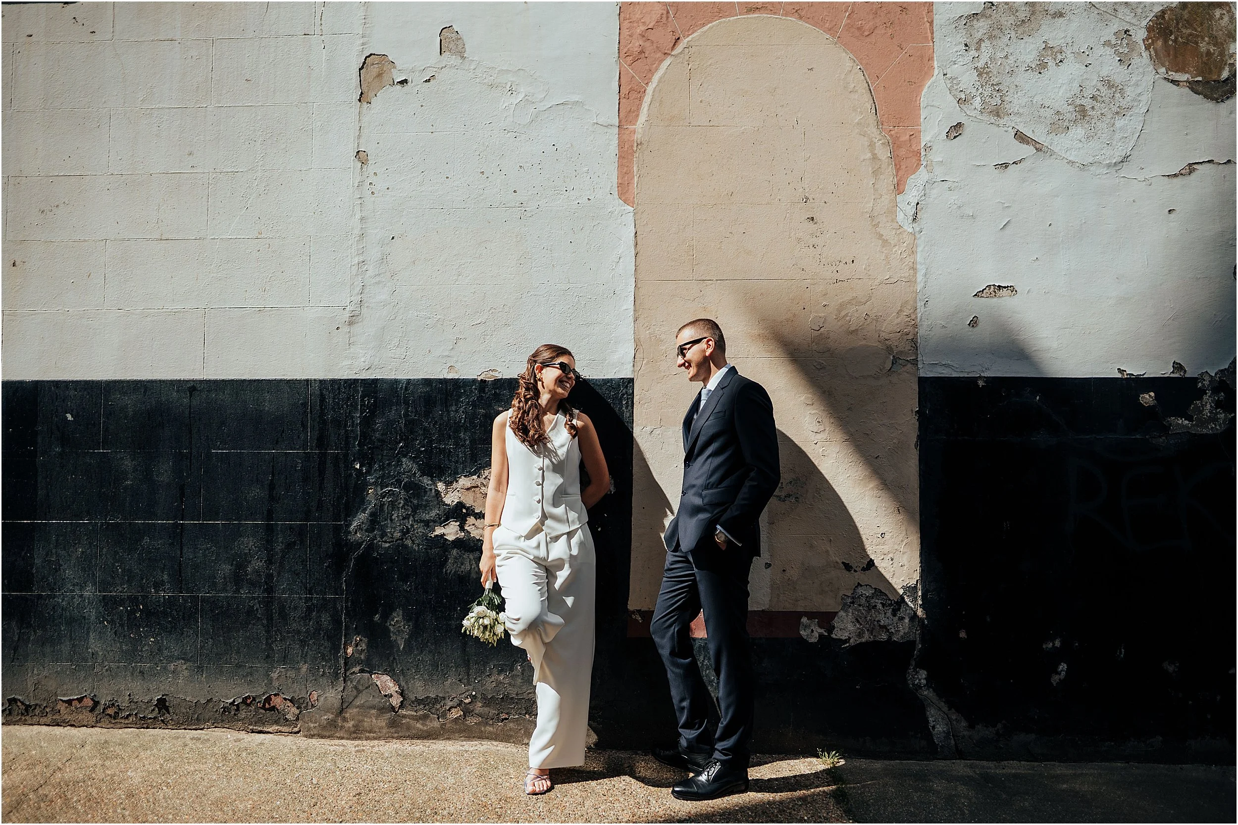 Sunny photo of bride and groom near old Marylebone town hall