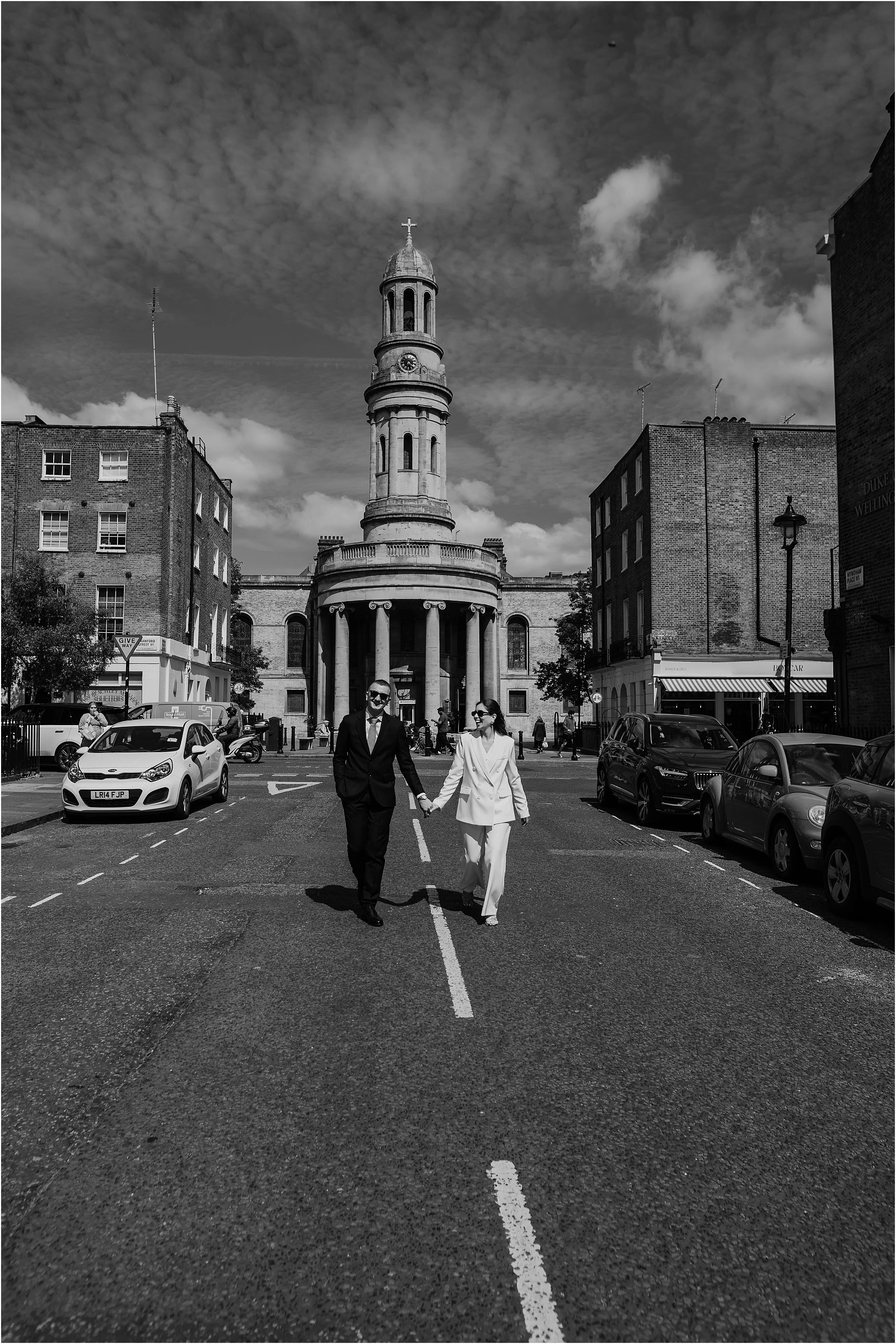 Newly eloped couple on streets of marylebone