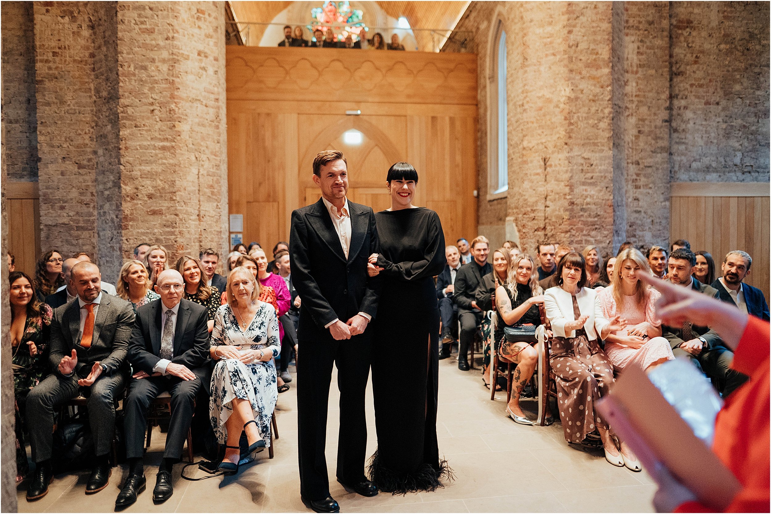 Bride and groom listening to reading