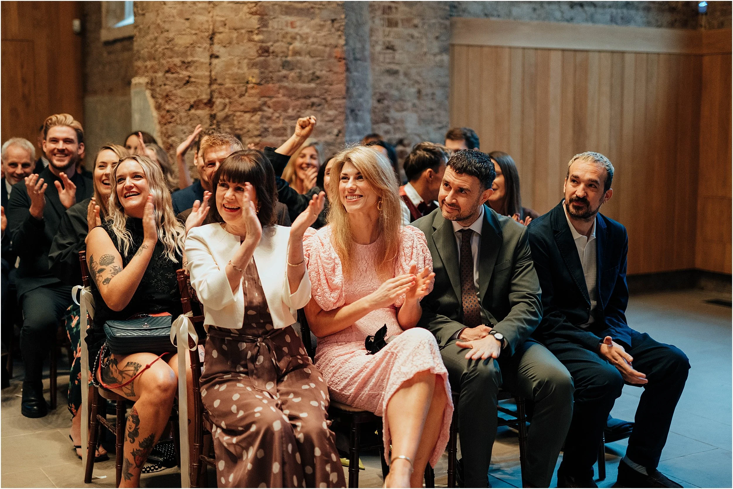 Wedding guests applauding