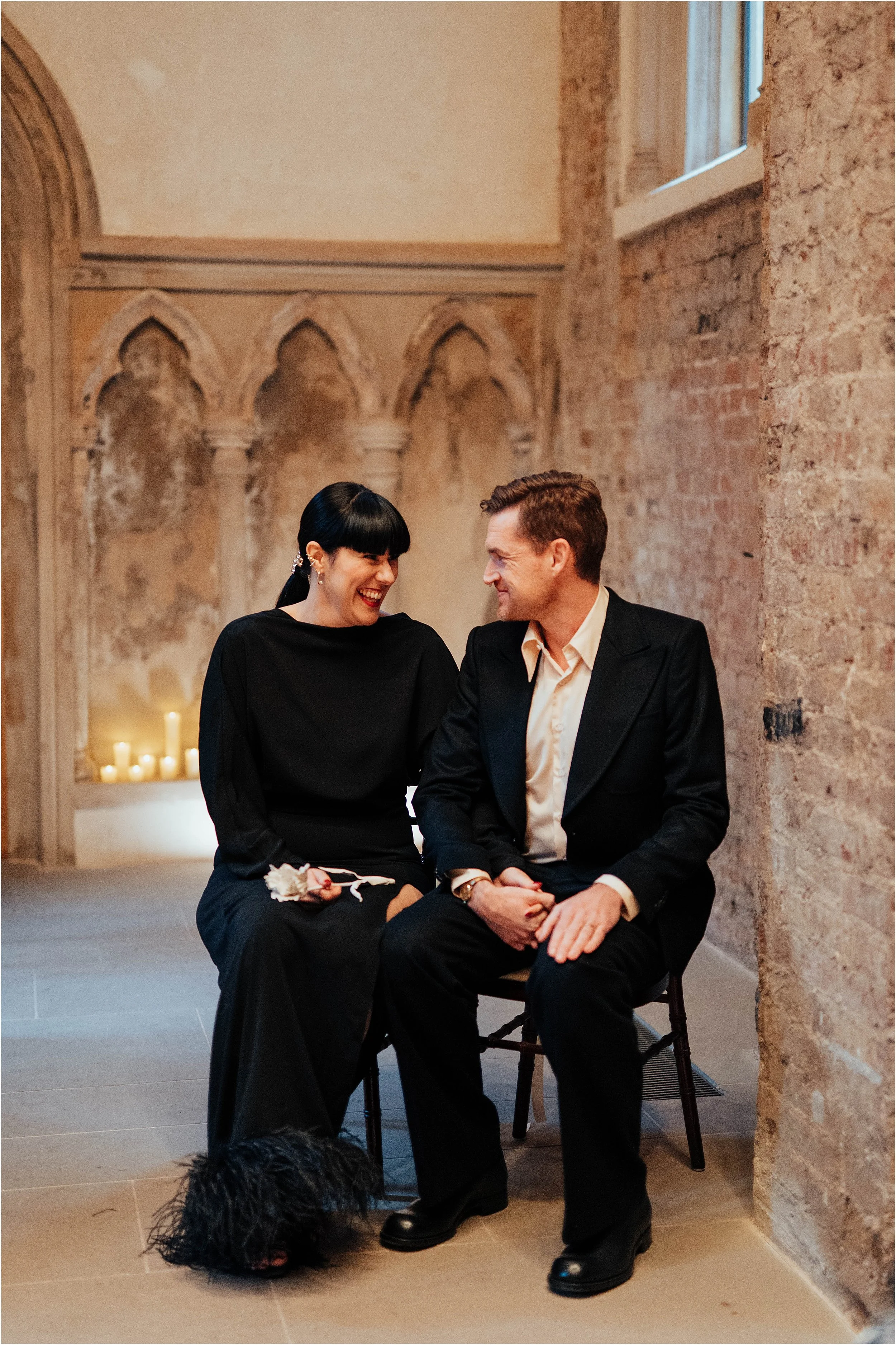 Bride and groom laughinb