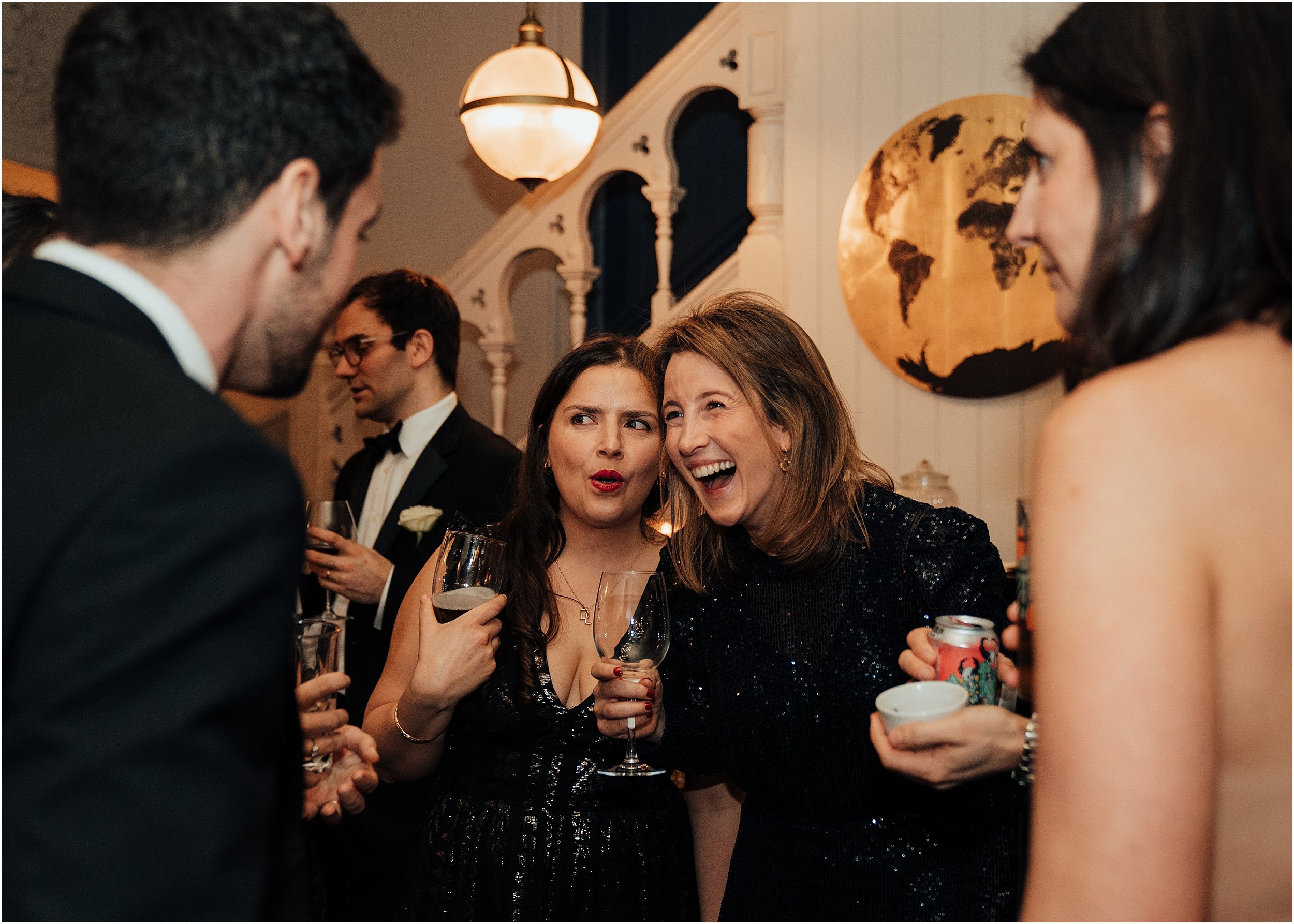Wedding guests chatting in Hare and Hounds Pub