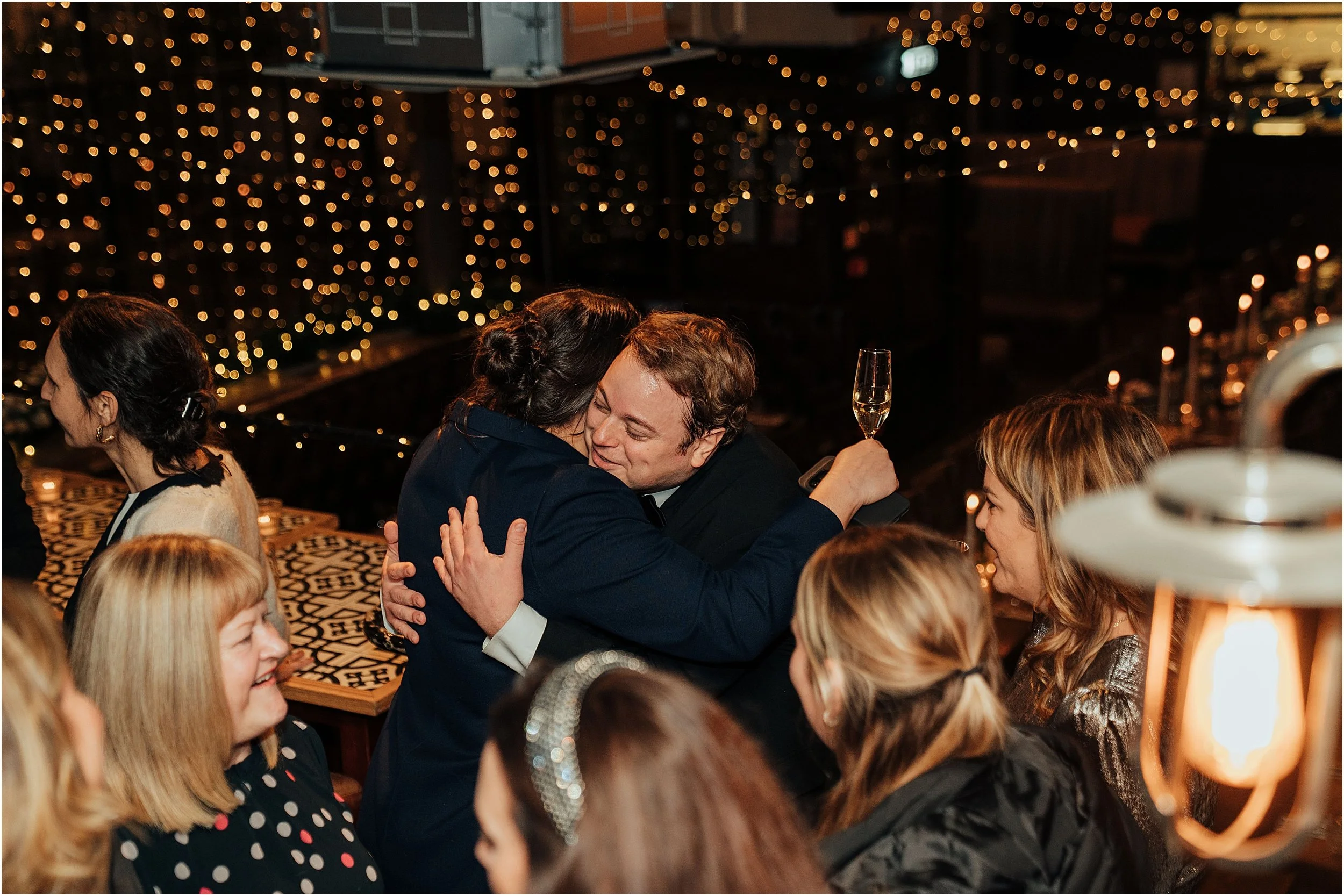 People hugging at reception at the Depot