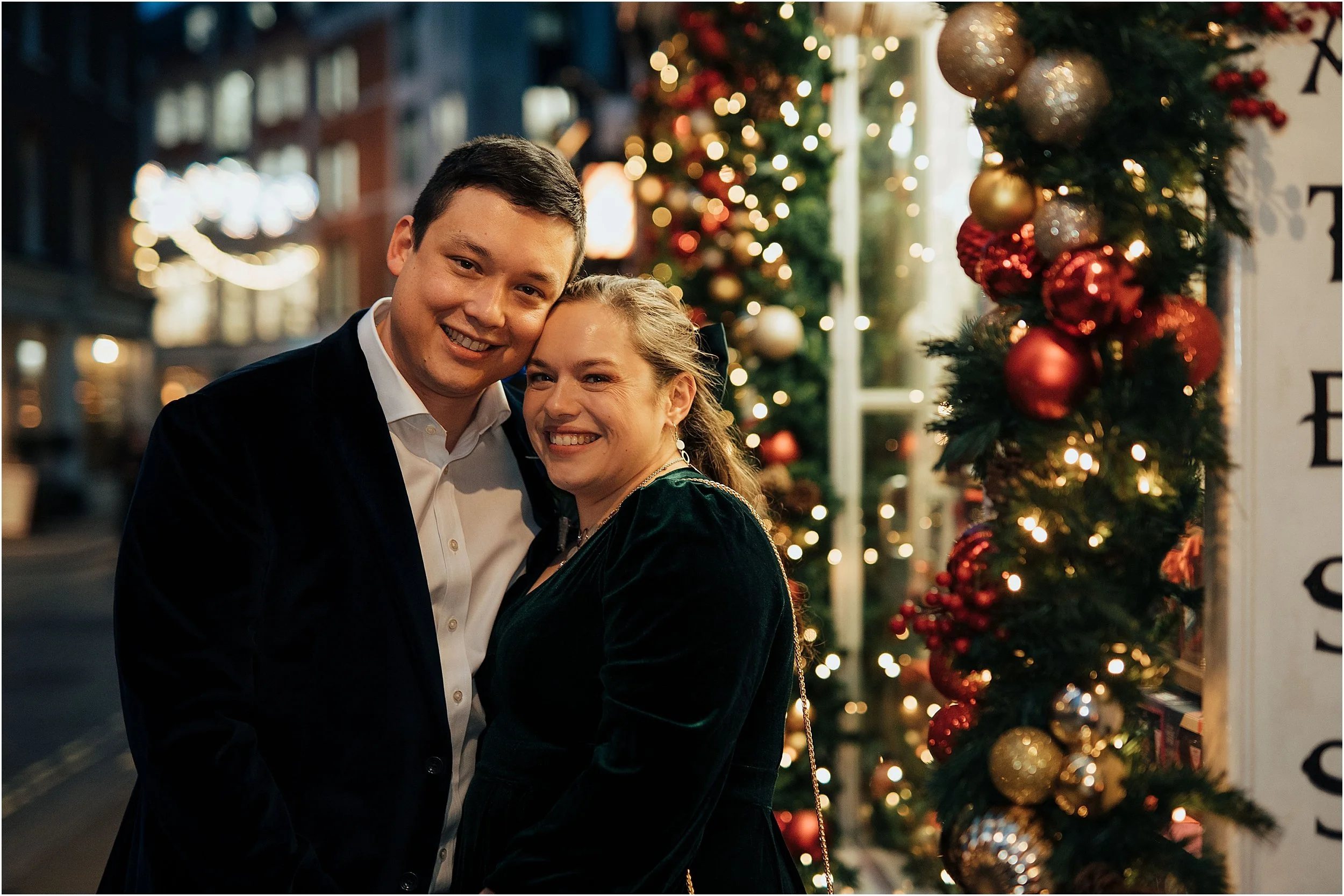 Newlywed couple portrait with Christmas lights in London