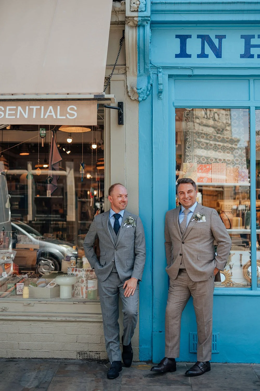 Two grooms posing for photos in London