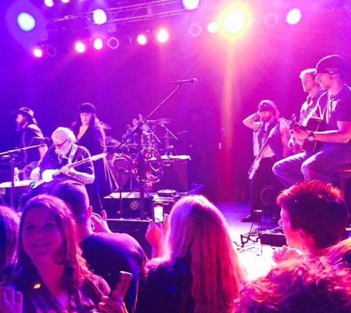 Sean Guerrero performing guitar with David Allan Coe at Lincoln Theater