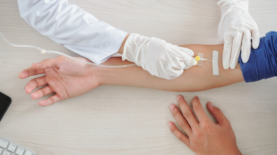 Healthcare professional preparing an IV iron infusion