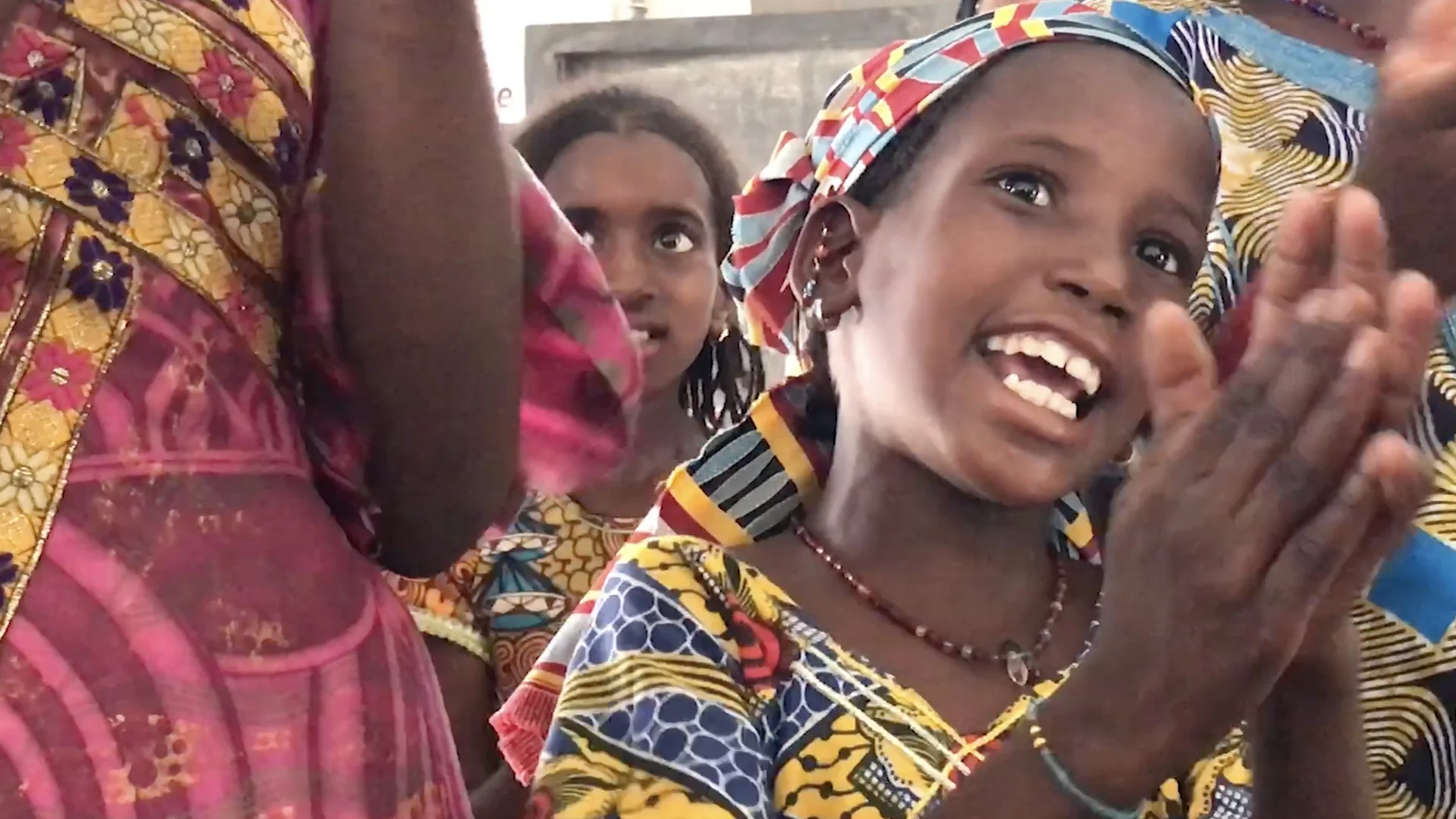 A fulani girls leads a traditional song in a UNICEF tent setup to help the children recover from the trauma of displacement through games and play.