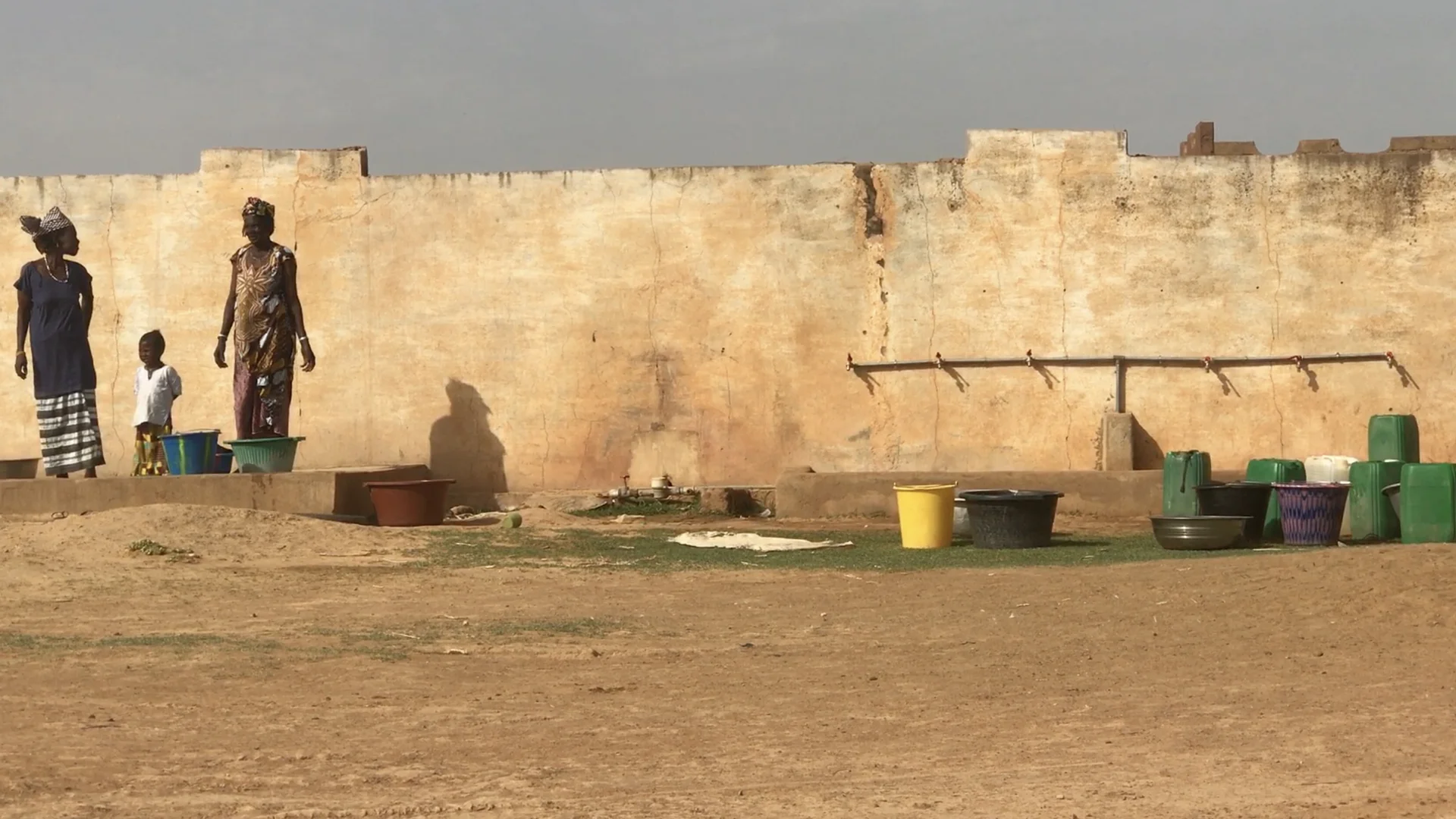 Women do the washing at a well installed by UNICEF at a camp for displaced people outside of Mopti. Violent attacks have forced families to flee to safety, but the surge of population in the towns has created shortages of essentials like water and f…