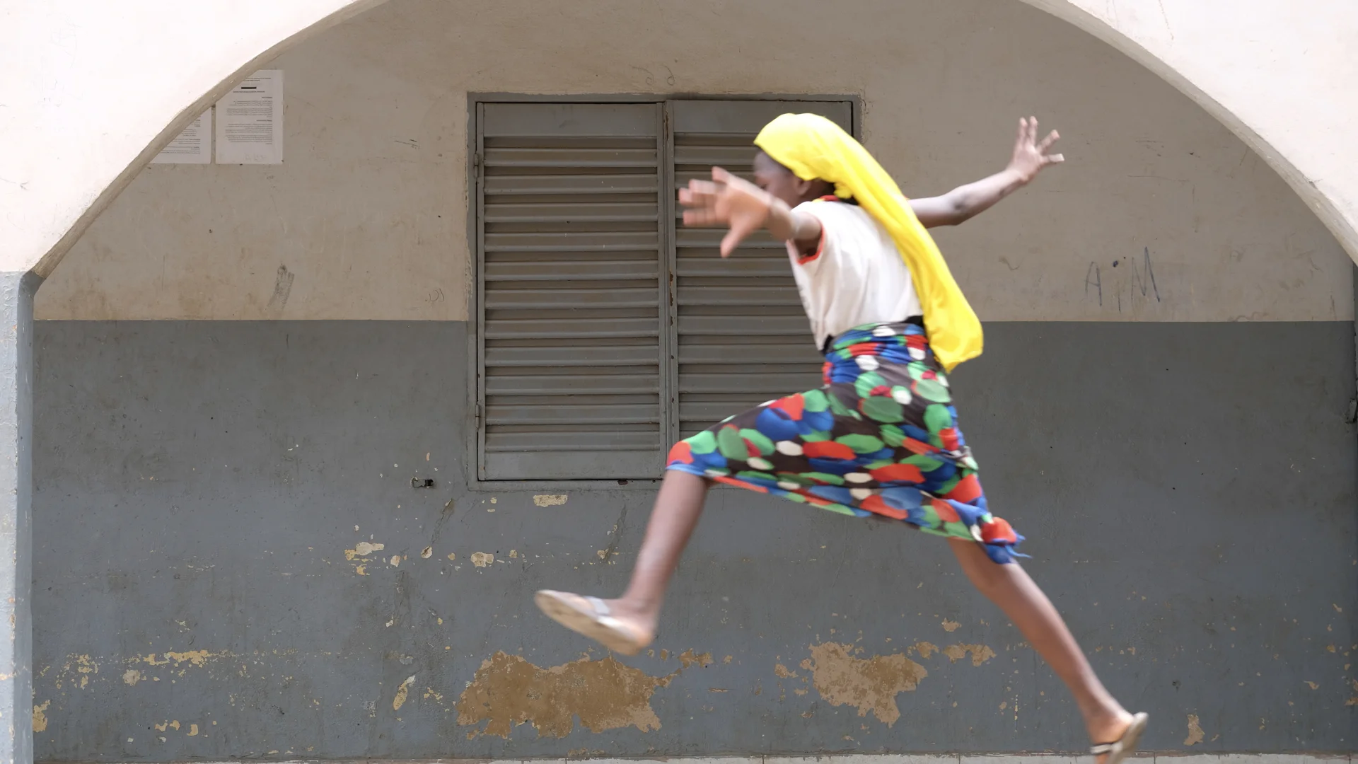 Salimata, age 9, jumps in the air at a center for displaced children and unaccompanied minors outside of Bamako. She’s one of thousands of children trying to get back to their families. As the violence continues, getting home only becomes harder.