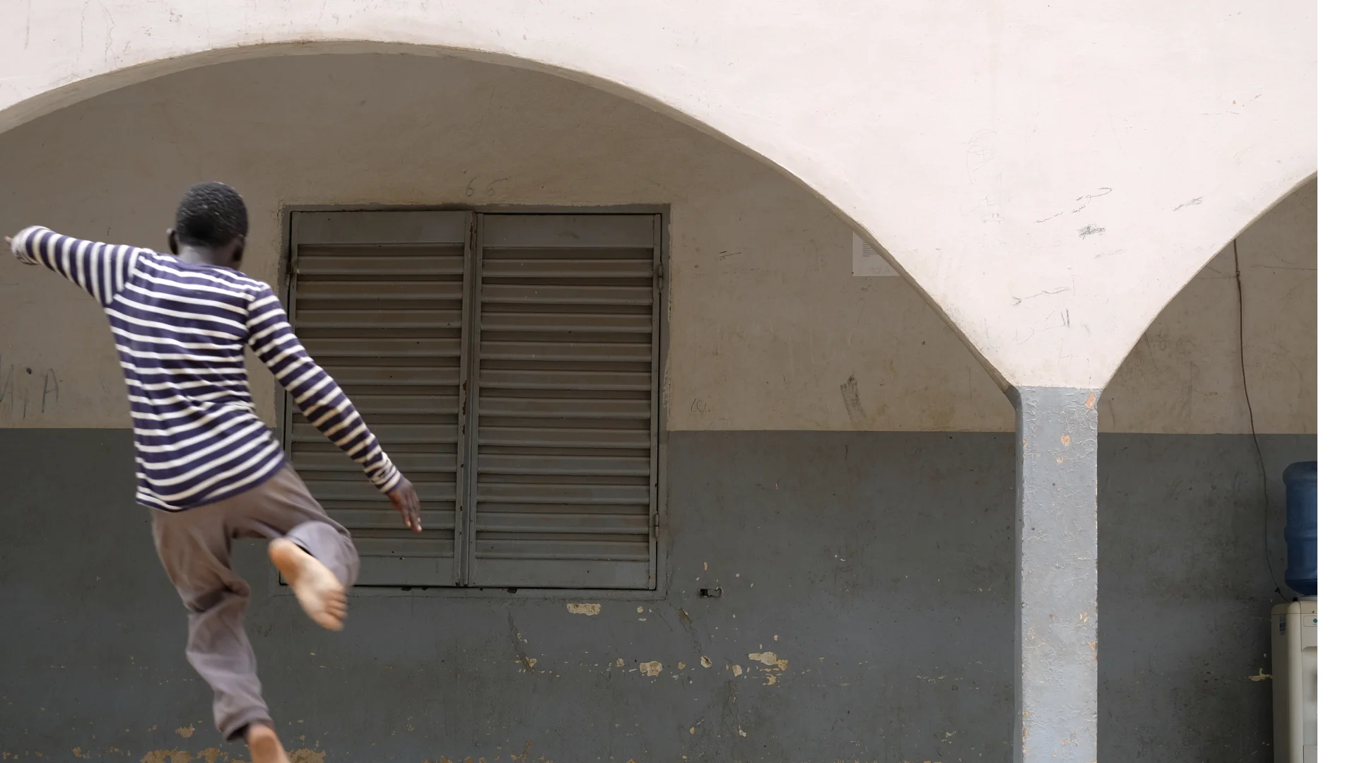 Nine year old Hamadou leaps into the air at a center outside of Bamako for unaccompanied minors. With the conflict escalating, more children are being separated from their parents as families flee. UNICEF is working to ensure all children are releas…
