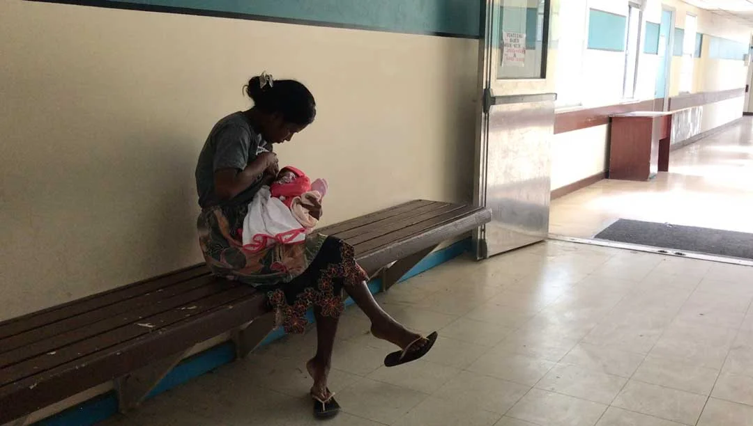 A mother breastfeeds her baby at Majuro Hospital in the Marshall Islands. With imported food like canned fish and white rice cheaper than local produce, mothers and children often suffer from malnutrition. The early childhood development project wil…