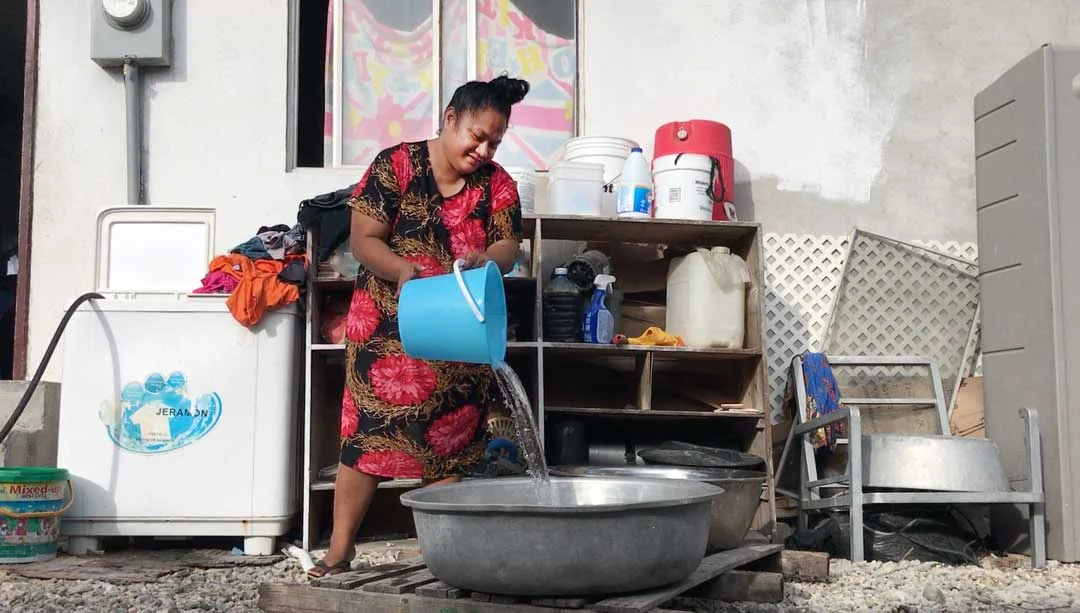 Liann Lorennij pours out the water to do the washing up at her house in Majuro in the Marshall Islands. As the mother of 8 children living in a house with more than 3o people, she says there is always laundry or dishes to do but the extended family …