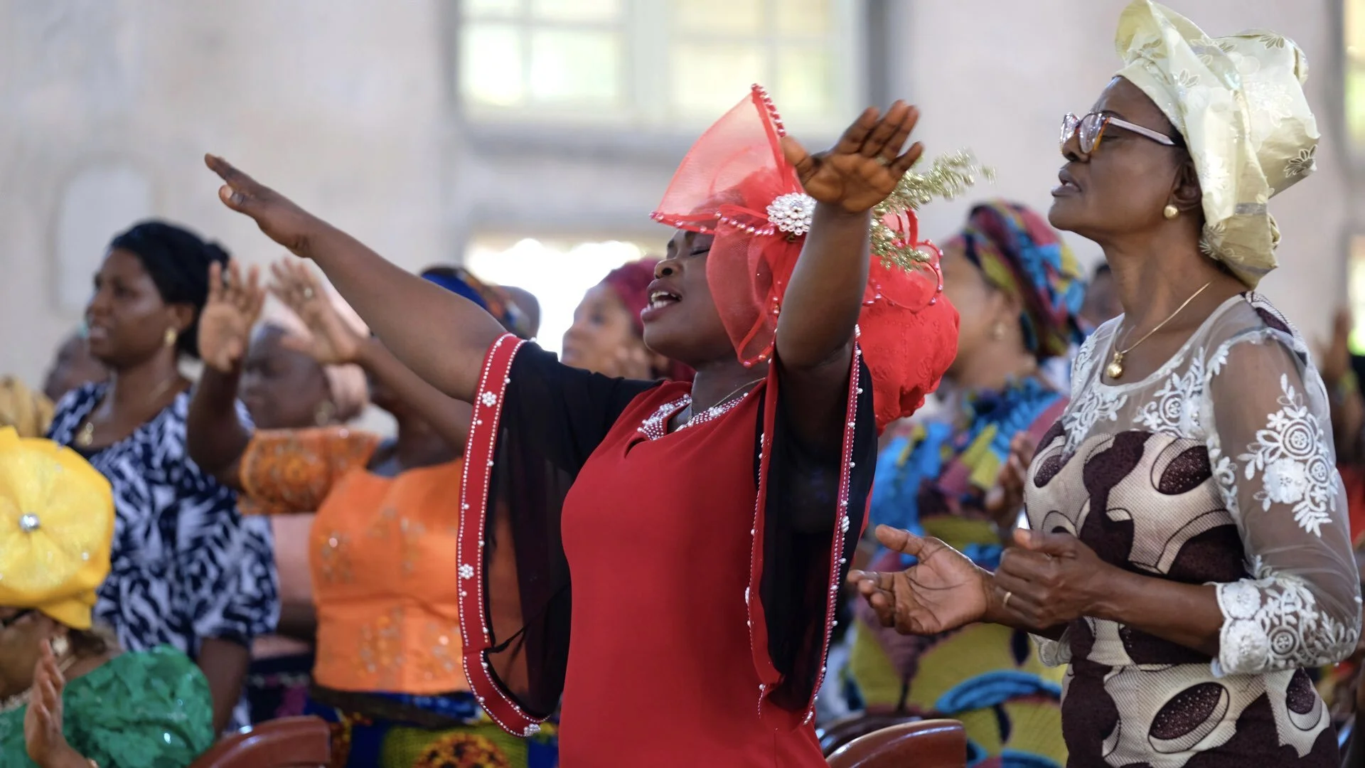 A woman prays at the Reformed Presbyterian Church of Abakaliki in Ebonyi state. The community has suffered with the epidemic of violence against girls including cases of child rape. The pastor says the church offers support to vulnerable girls who a…