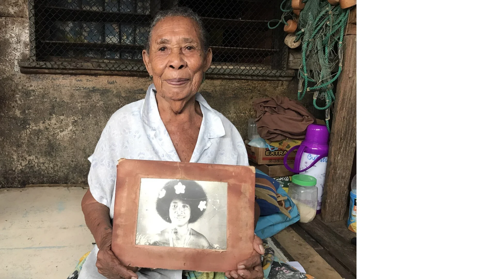 Papua New Guinea: Helen is 90 years old and she lives in Port Moresby in Papua New Guinea. She holds a photo from when she was just 18 with flowers in her hair. Back then, Hanuabada was a fishing village and the capital felt far away. 70 years on, u…