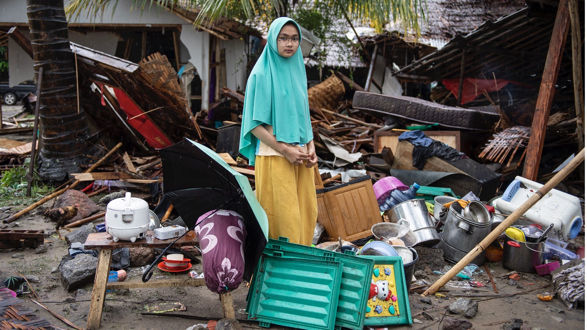 Indonesia.: Sinta, 19, stands near her house which collapsed during the tsunami, in Pesauran Village, Cinangka District, Serang, Banten.On 24 December 2018 in Indonesia. ©UNICEF