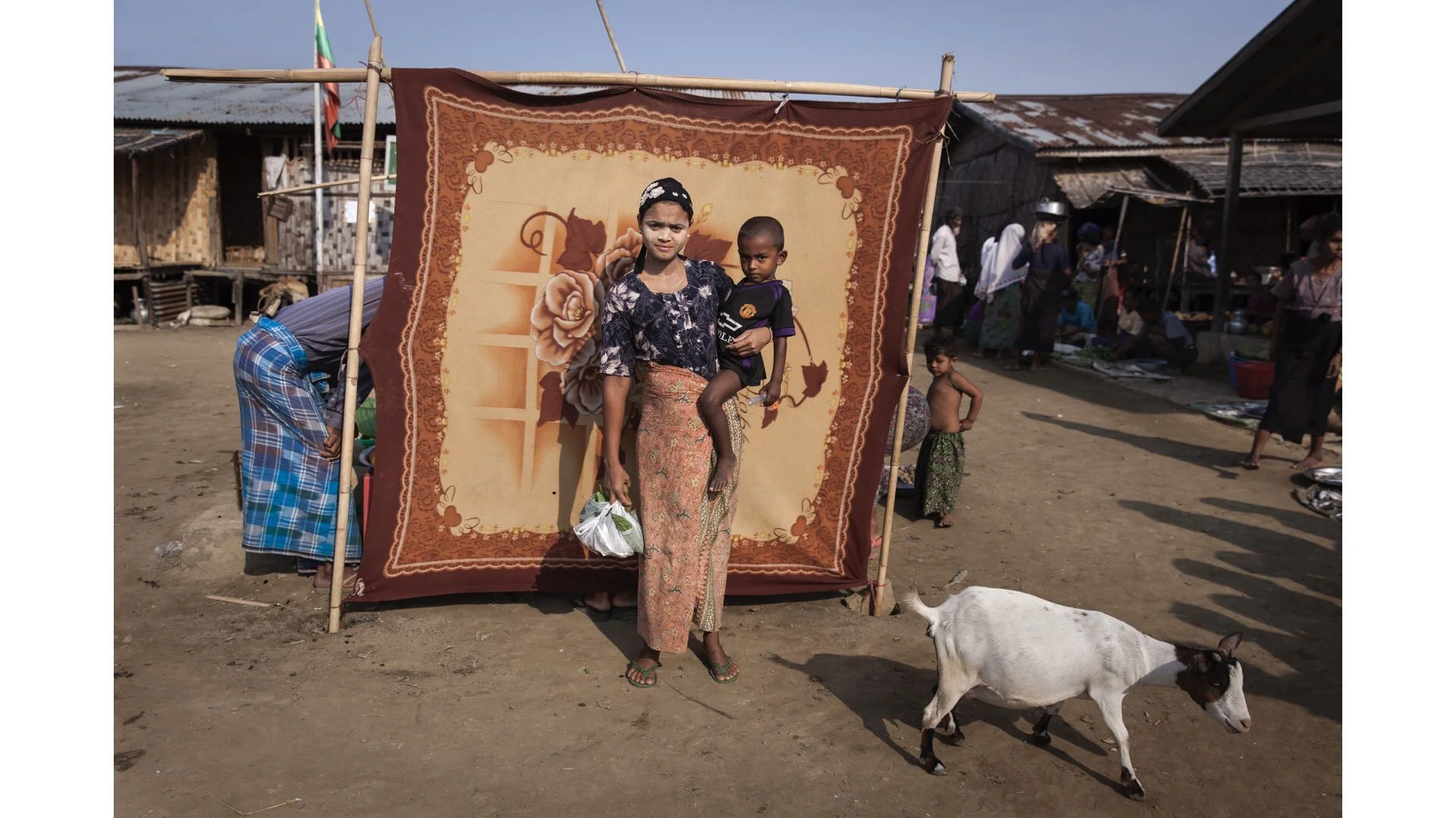Myanmar: Khn Me Cho, 20, holds her son Min Lus Neing, 3, at the Sin Tet Maw camp for internally displaced persons in Rakhine State, Myanmar, ©UNICEF
