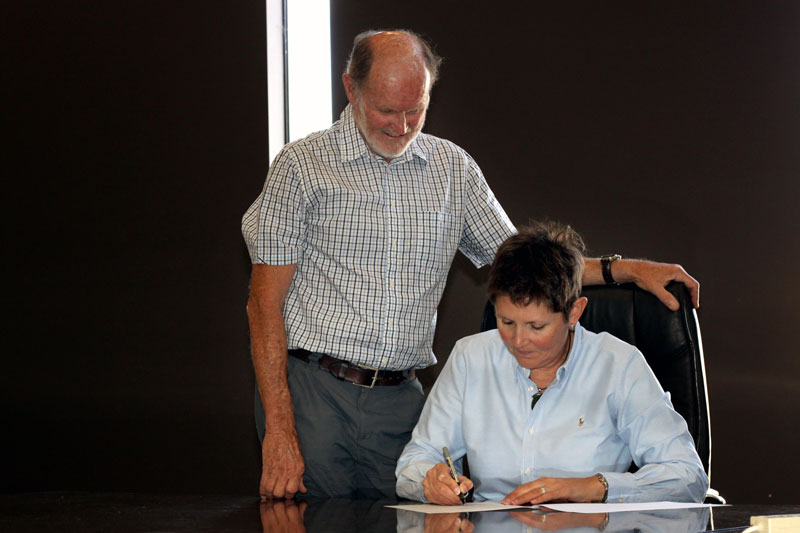 Lisa Glastonbury, Wagga Rail Trail chairperson, signing the Implementation Plan contract