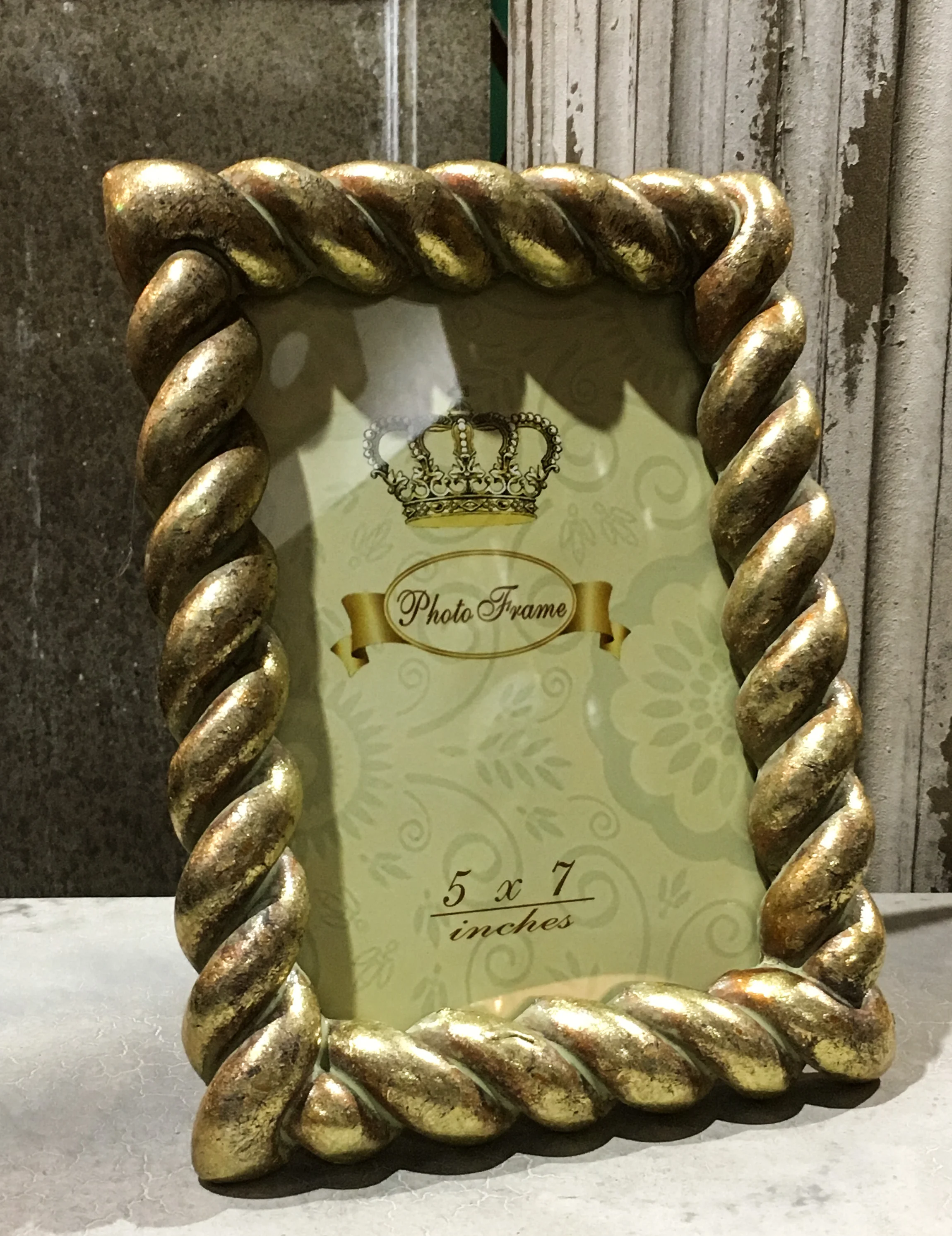 Twisted rope frame with an elegant gilt finish.jpg
