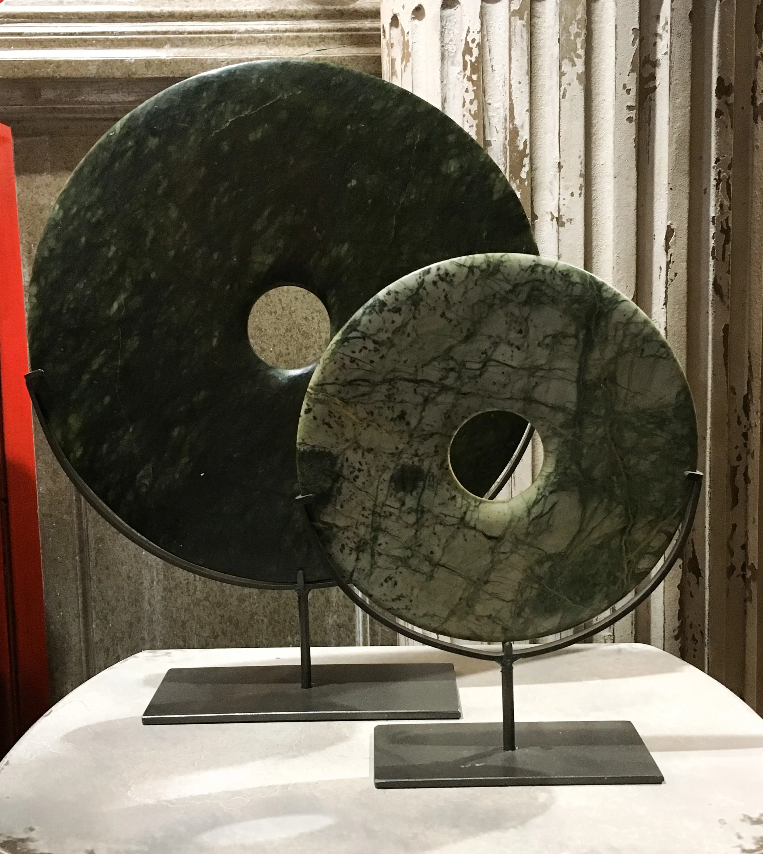 Jade disc sculpture on a stand .jpg