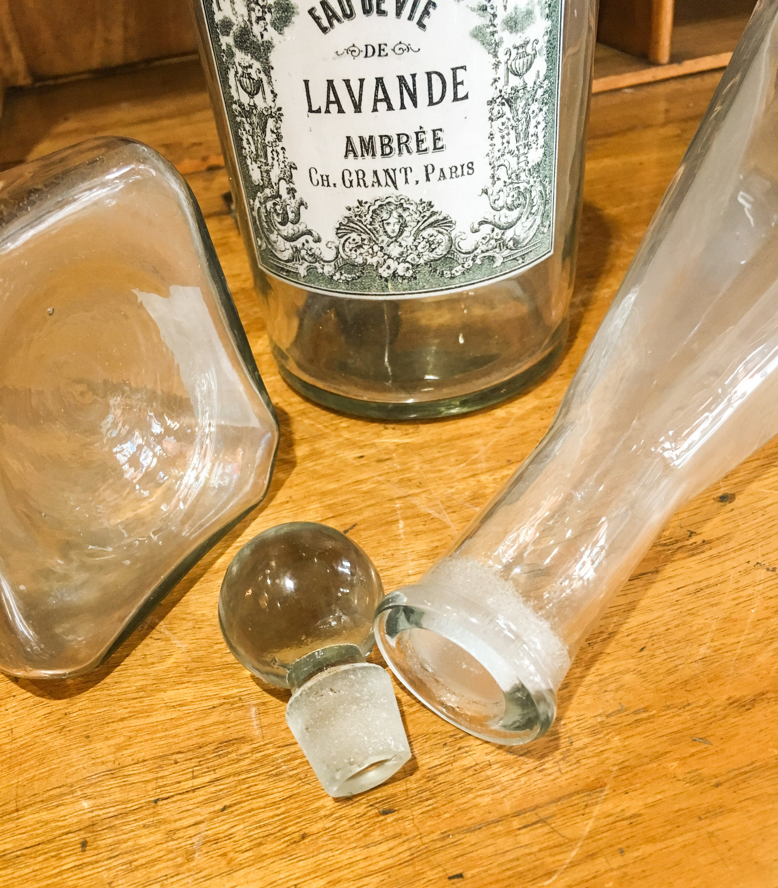 A replica of an old cologne bottle in different styles