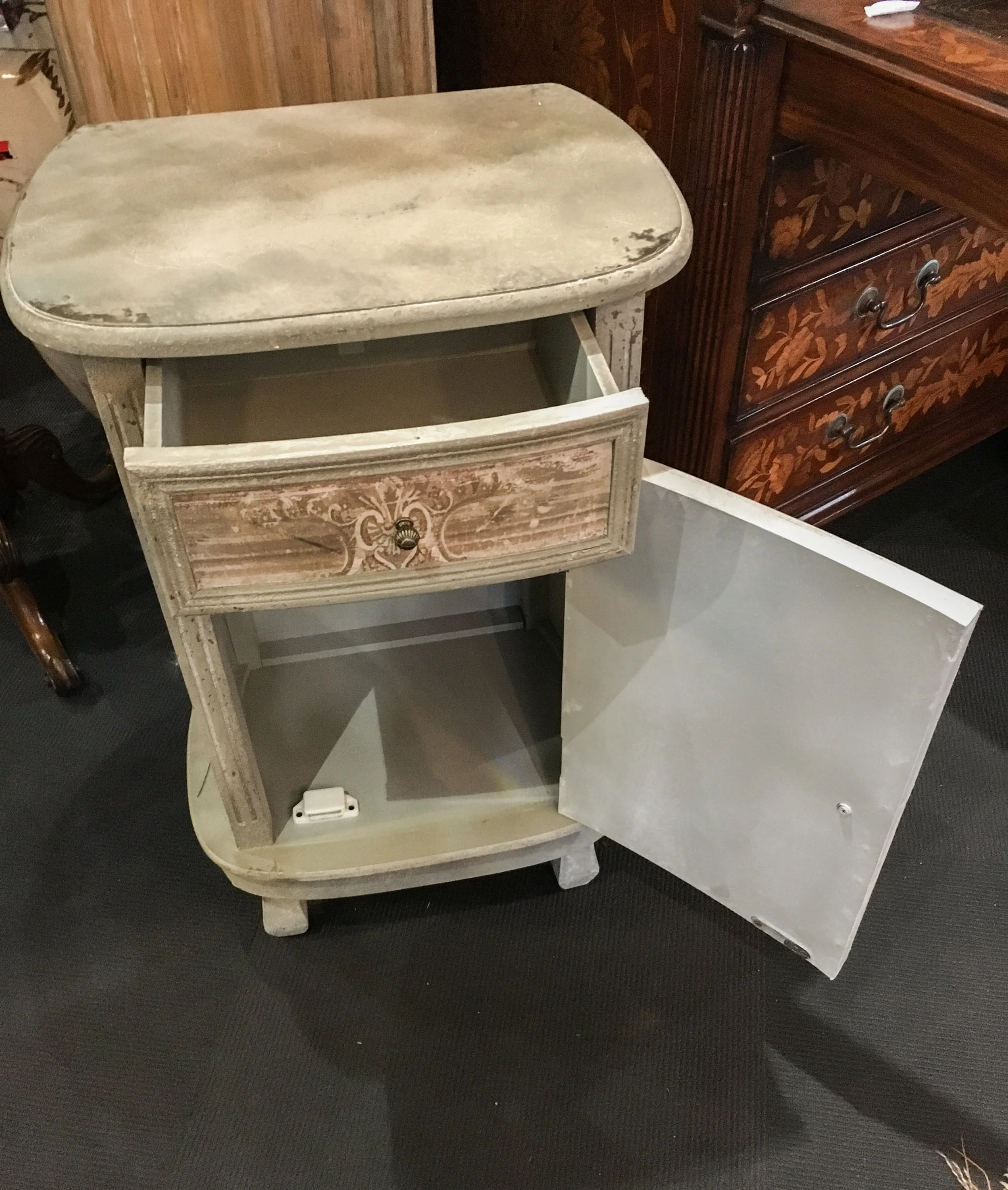 A pretty bedside with drawer and cupboard