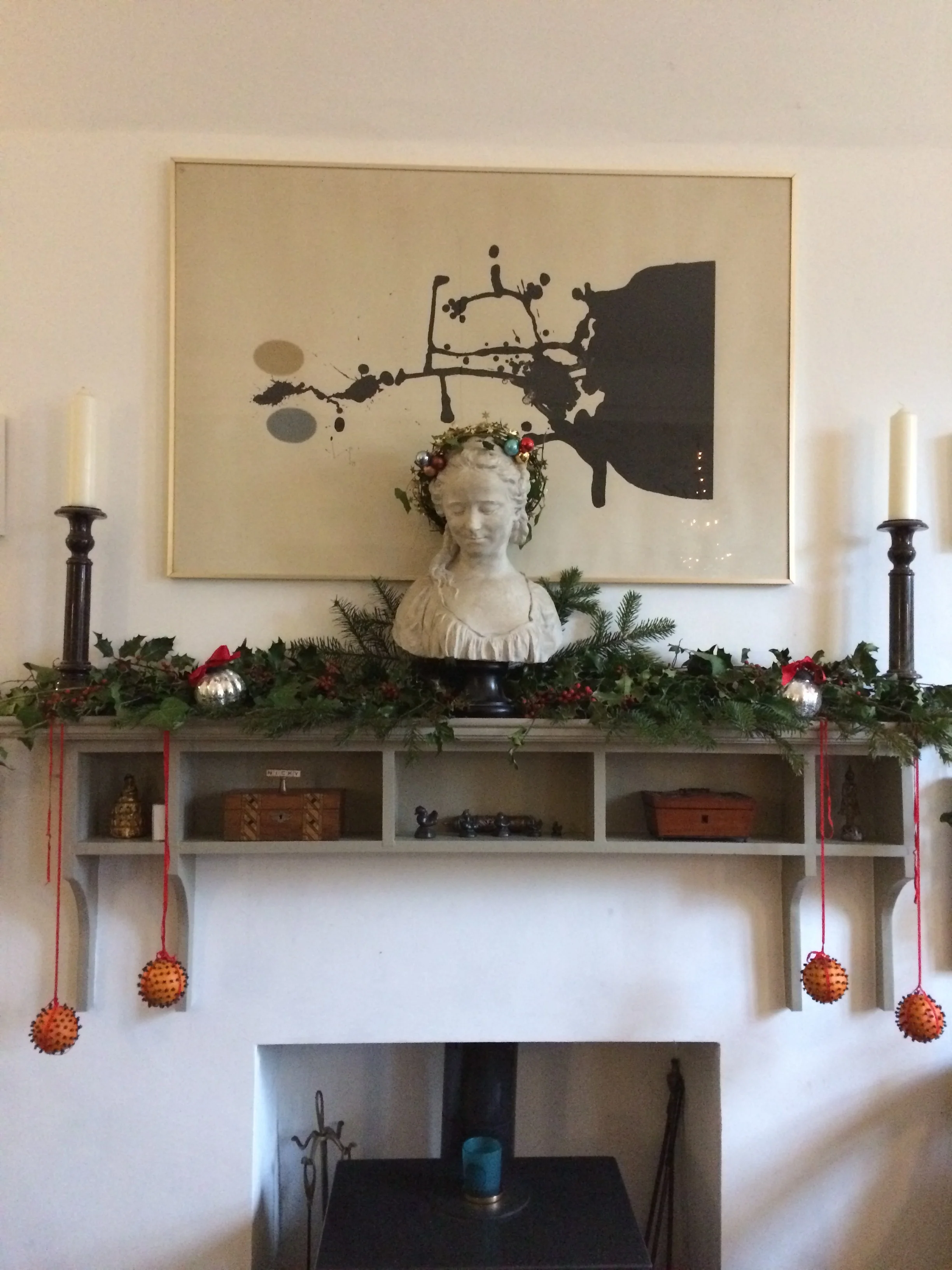 Traditional natural foliage, glove oranges for scent, candle and a centre piece from Nicky Percival Ltd