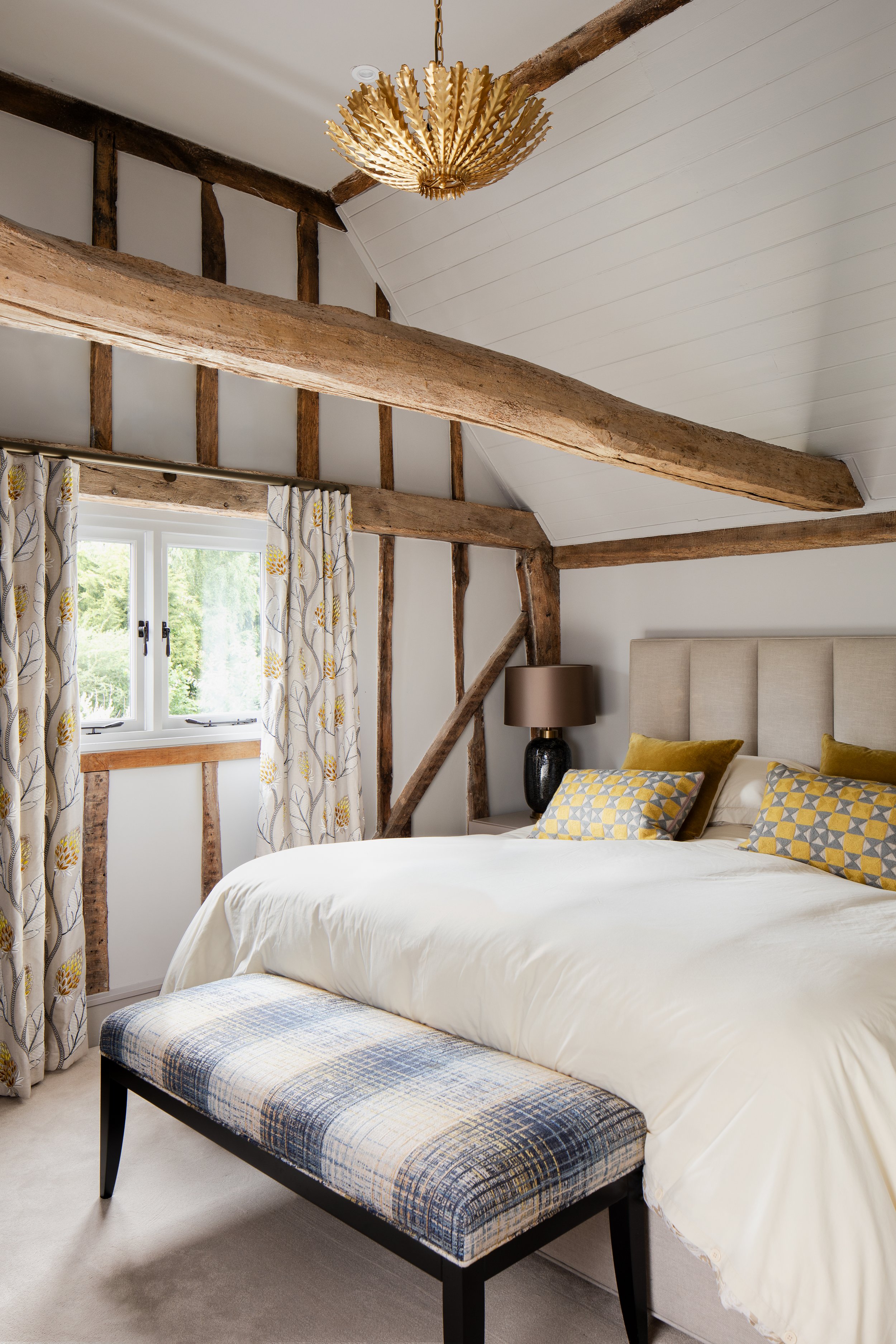 Cottage conversion bedroom with oak beams.jpg