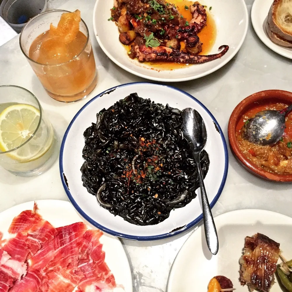 TORO Squid ink risotto, jamón ibérico, pulpo, chef's selection of pinchos, cocteles.