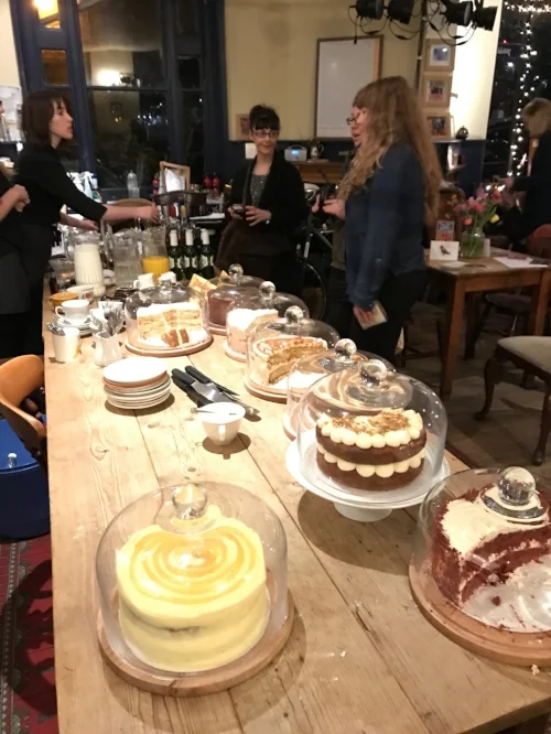 Essie Fox, in the middle, scoping out the cakes before her turn in the chair next month.