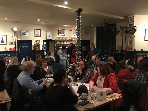 The audience arriving and settling in