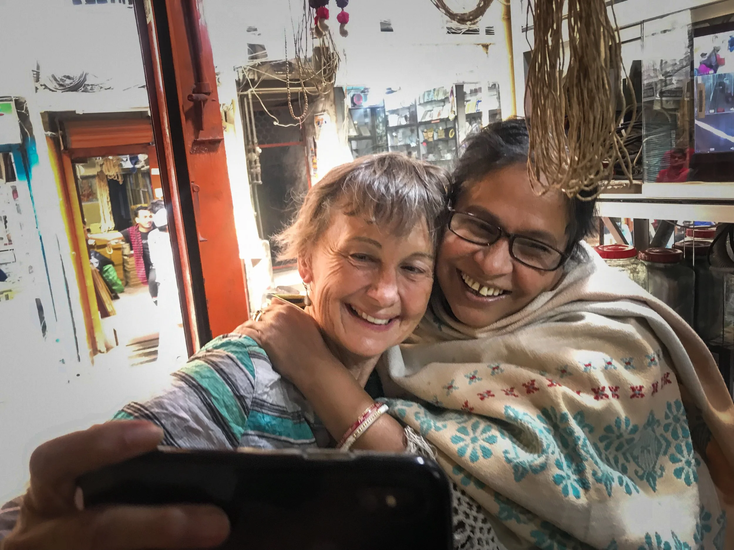 Manoj grabbed a picture of our Christmas Day love fest after this woman clasped the basil seed necklace around my neck.