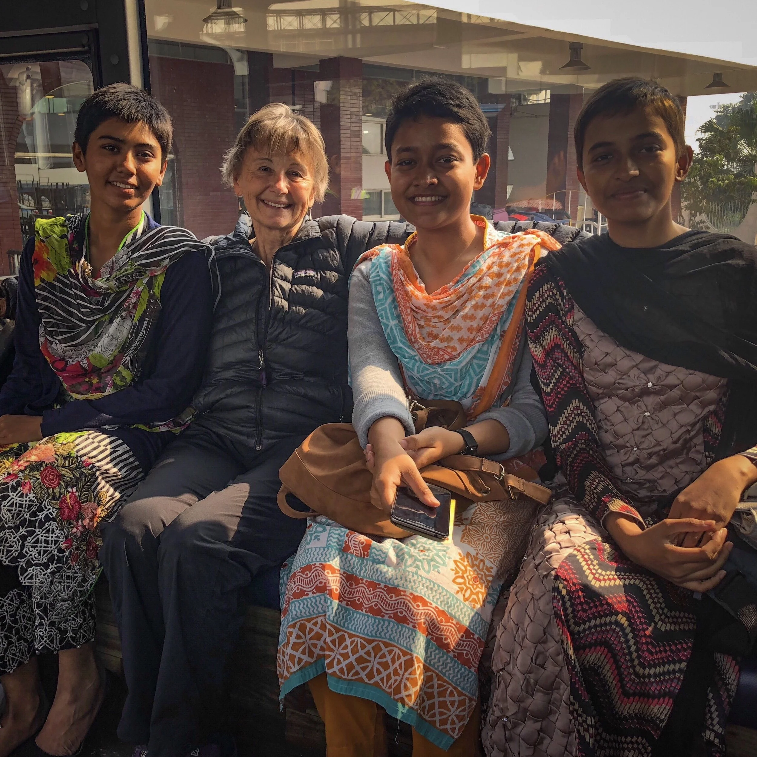 At the airport with three Air Force officers—a pilot, an aeronautical engineer, and an avionics engineer.