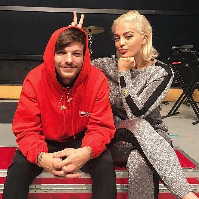 Louis Tomlinson in a Balenciaga hoodie (pictured with collaborator Bebe Rexha)