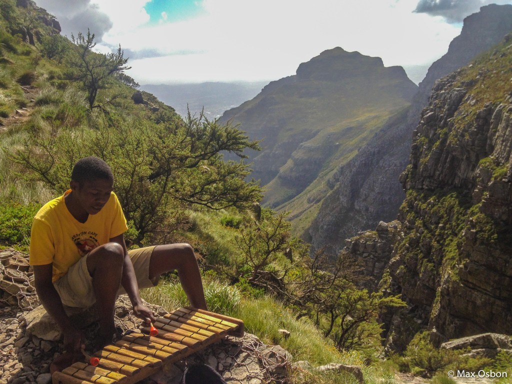This guy hangs out near the top of Table Mountain playing music all day.