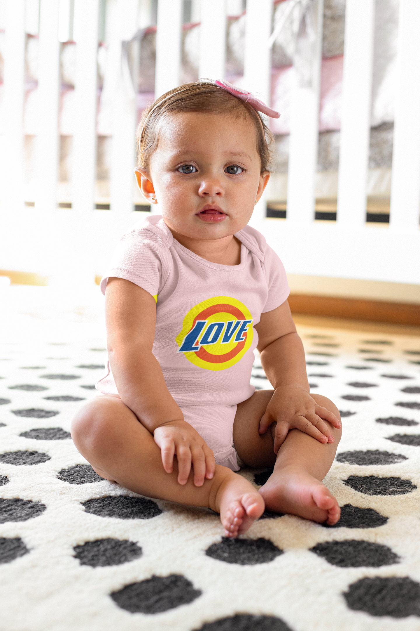 sublimated-onesie-mockup-of-a-baby-girl-sitting-on-a-carpet-m920.png
