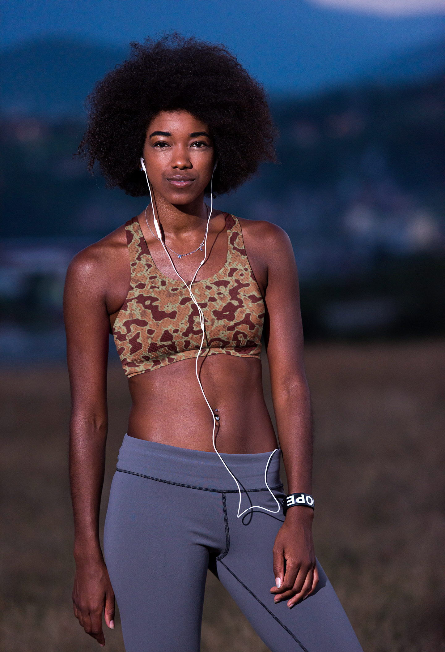 mockup-featuring-a-woman-with-a-sports-bra-standing-by-a-park-34352-r-el2.png